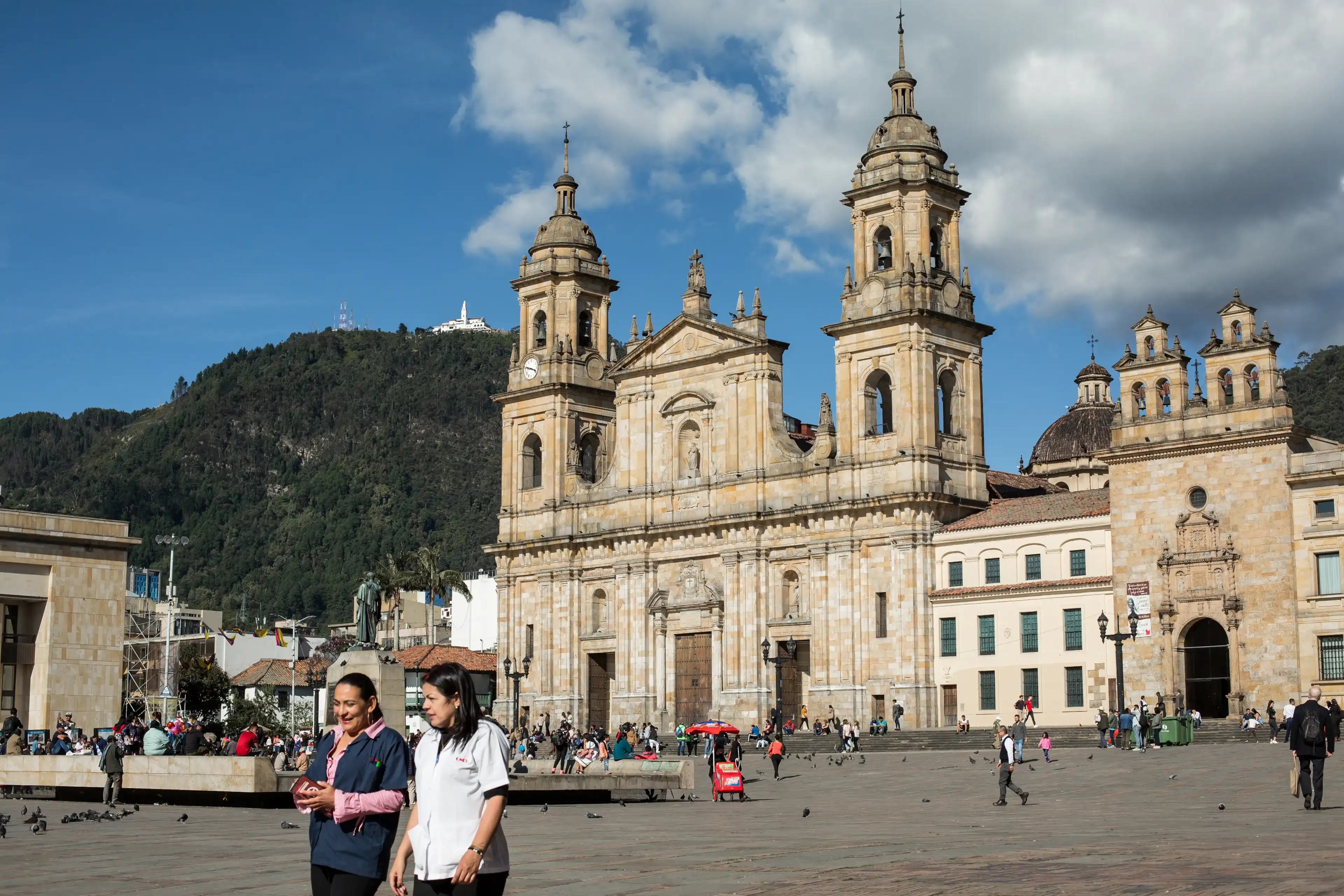 Bogota, DC / Colombia - August 21 2019: Women walking by at the Bolivar square Bogota, DC / Colombia - August 21 2019: Women walking by at the Bolivar square