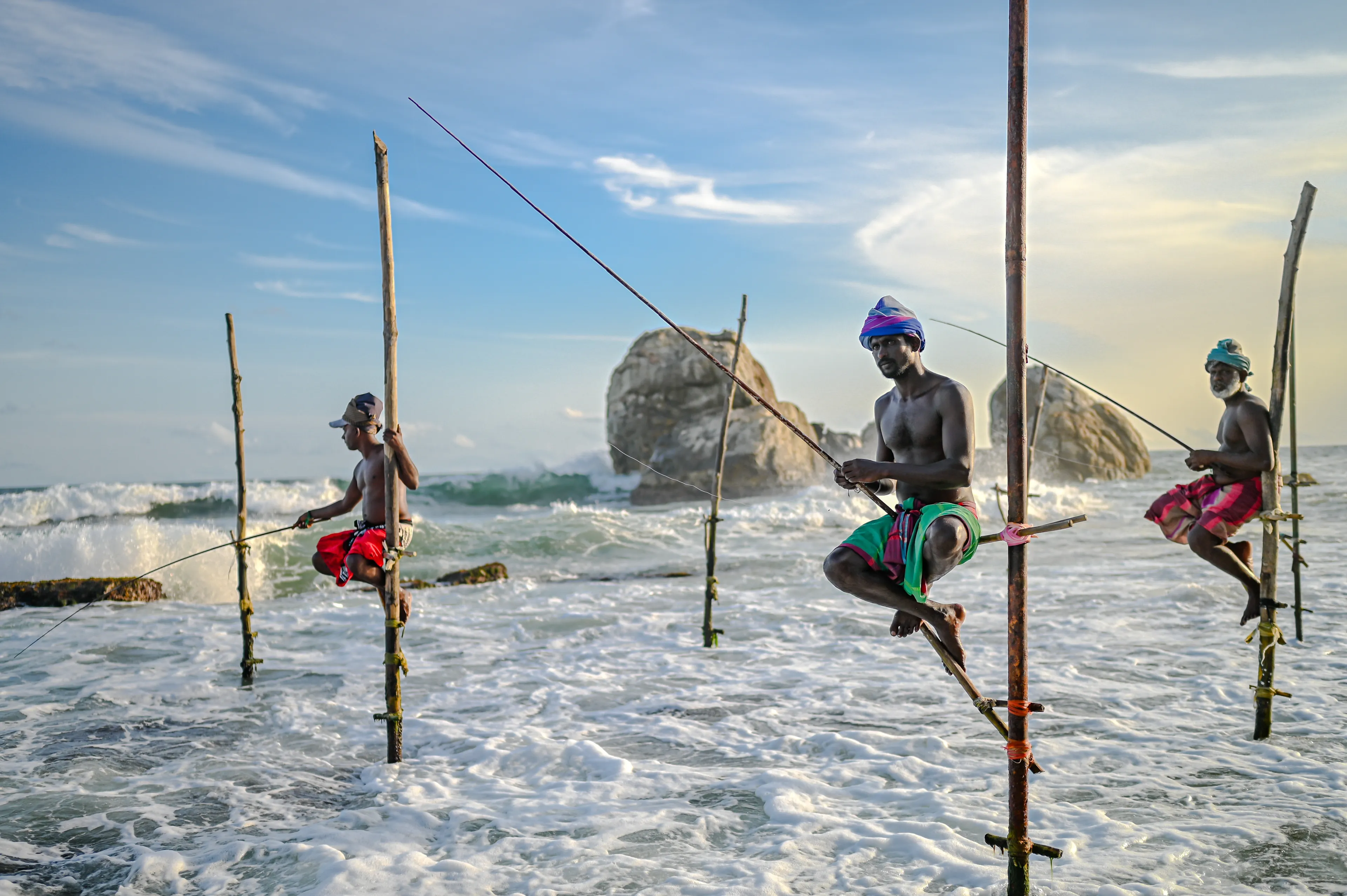 Koggala, Sri Lanka- July 24 2024: Stilt Fishing is a traditional style of fishing practised by local fishermen in Sri Lanka, especially on the southern coast.