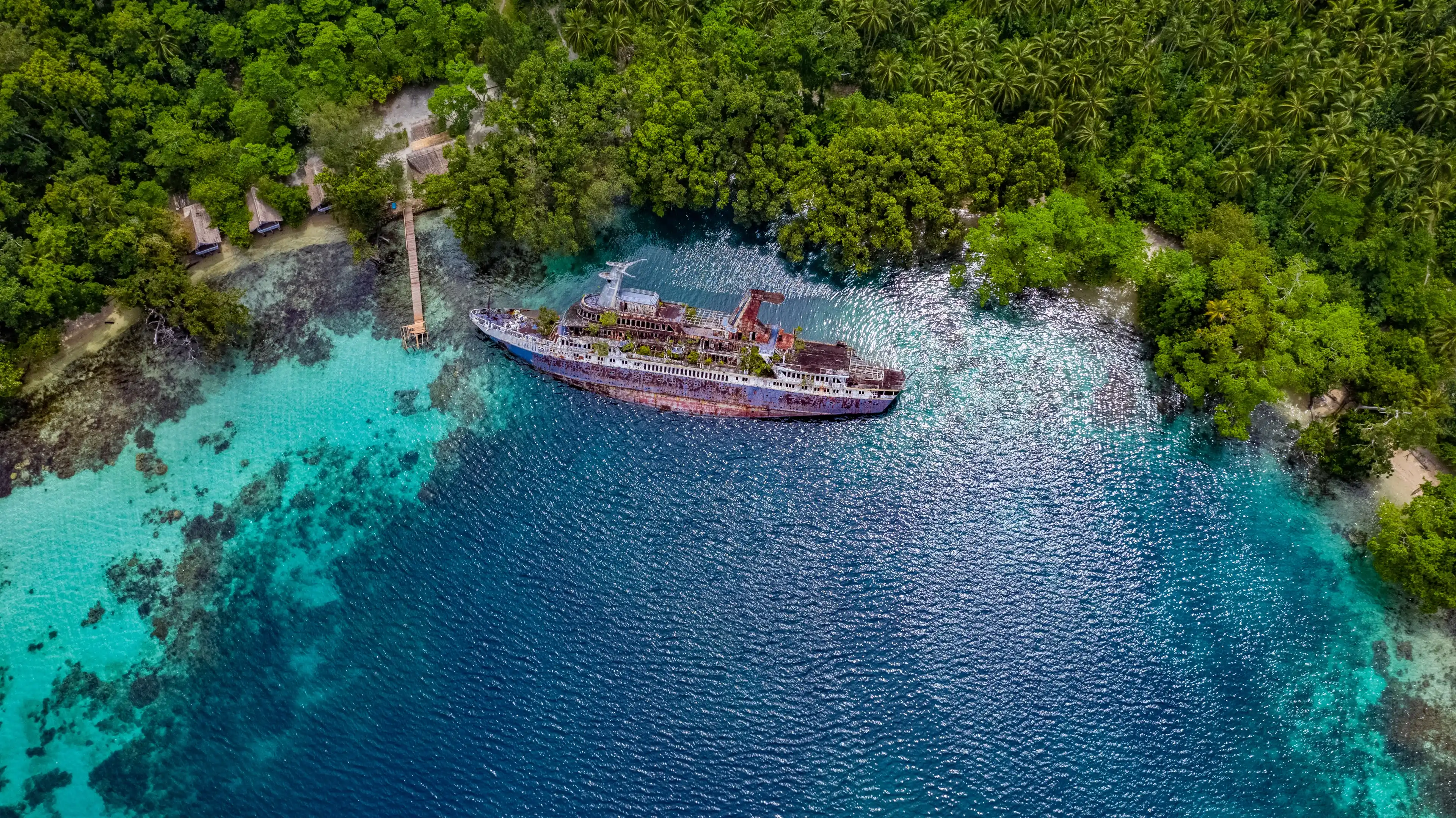 Half sunken ship at Roderick Bay in Solomon Islands Half sunken ship at Roderick Bay in Solomon Islands