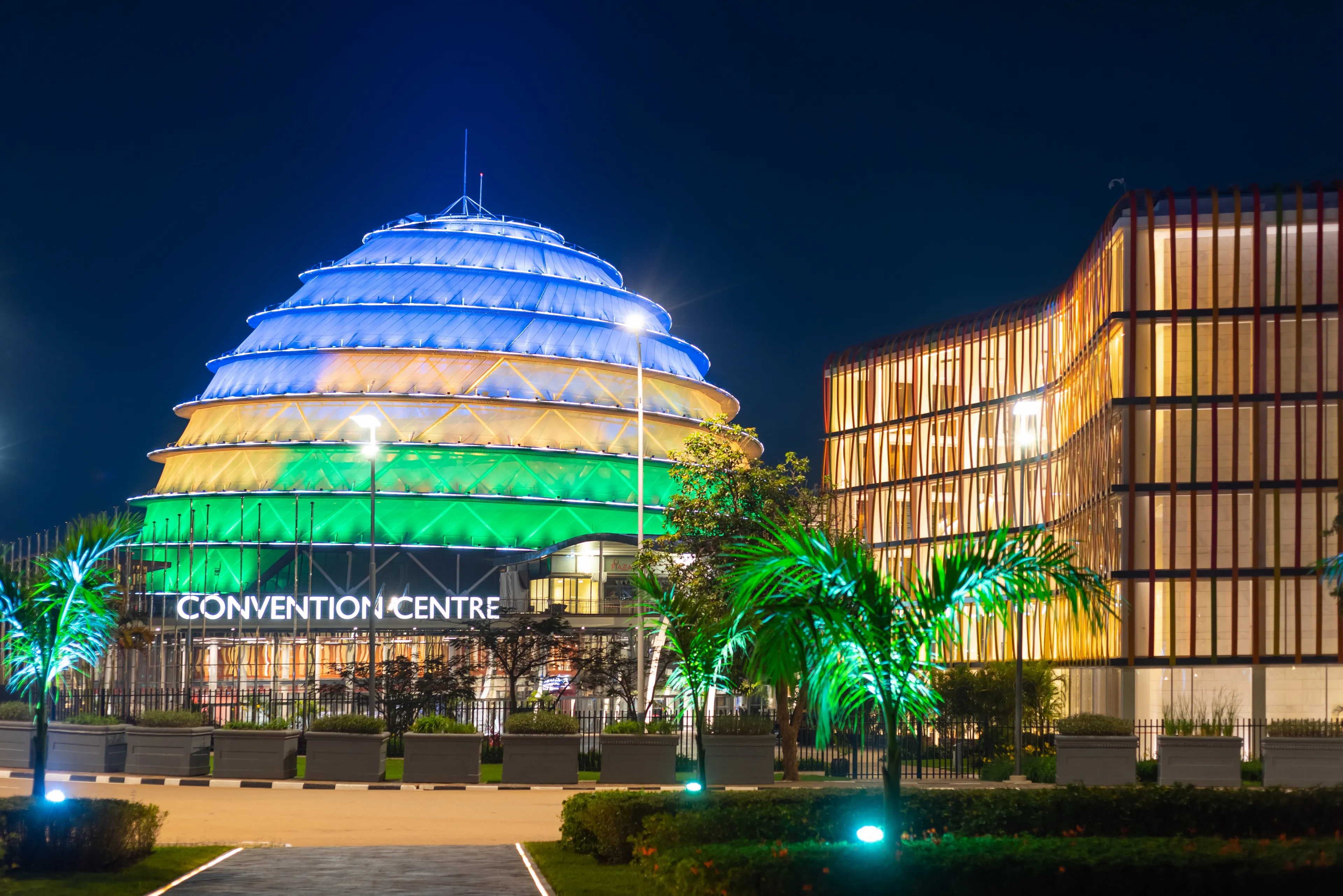 Kigali, Rwanda - August 19 2022: Kigali Convention Centre at night, lit up in the colors of the Rwandan flag. The facility is designed to host a variety of events and is a top attraction in the city.