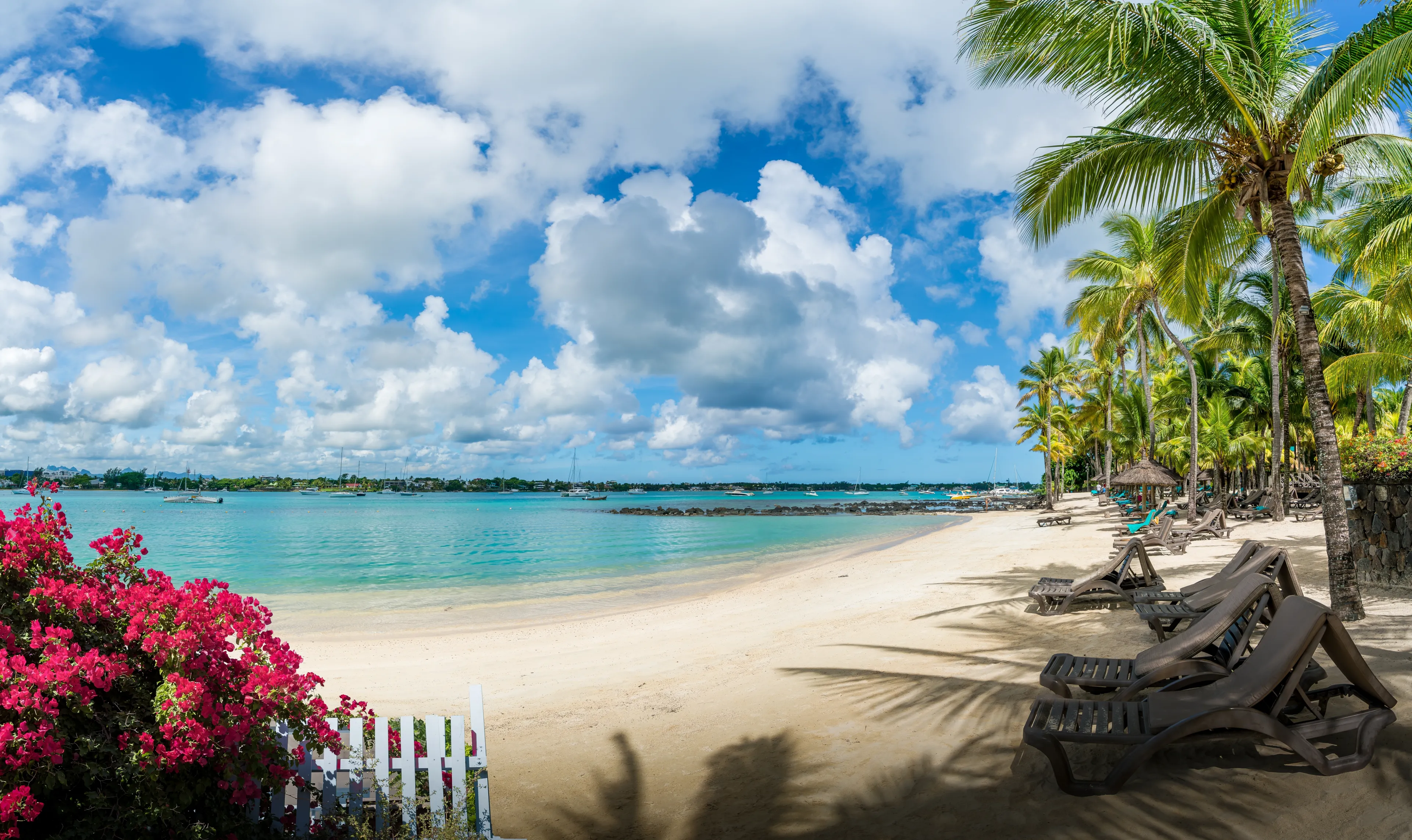 Landscape with public beach at Grand baie village on Mauritius island, Africa