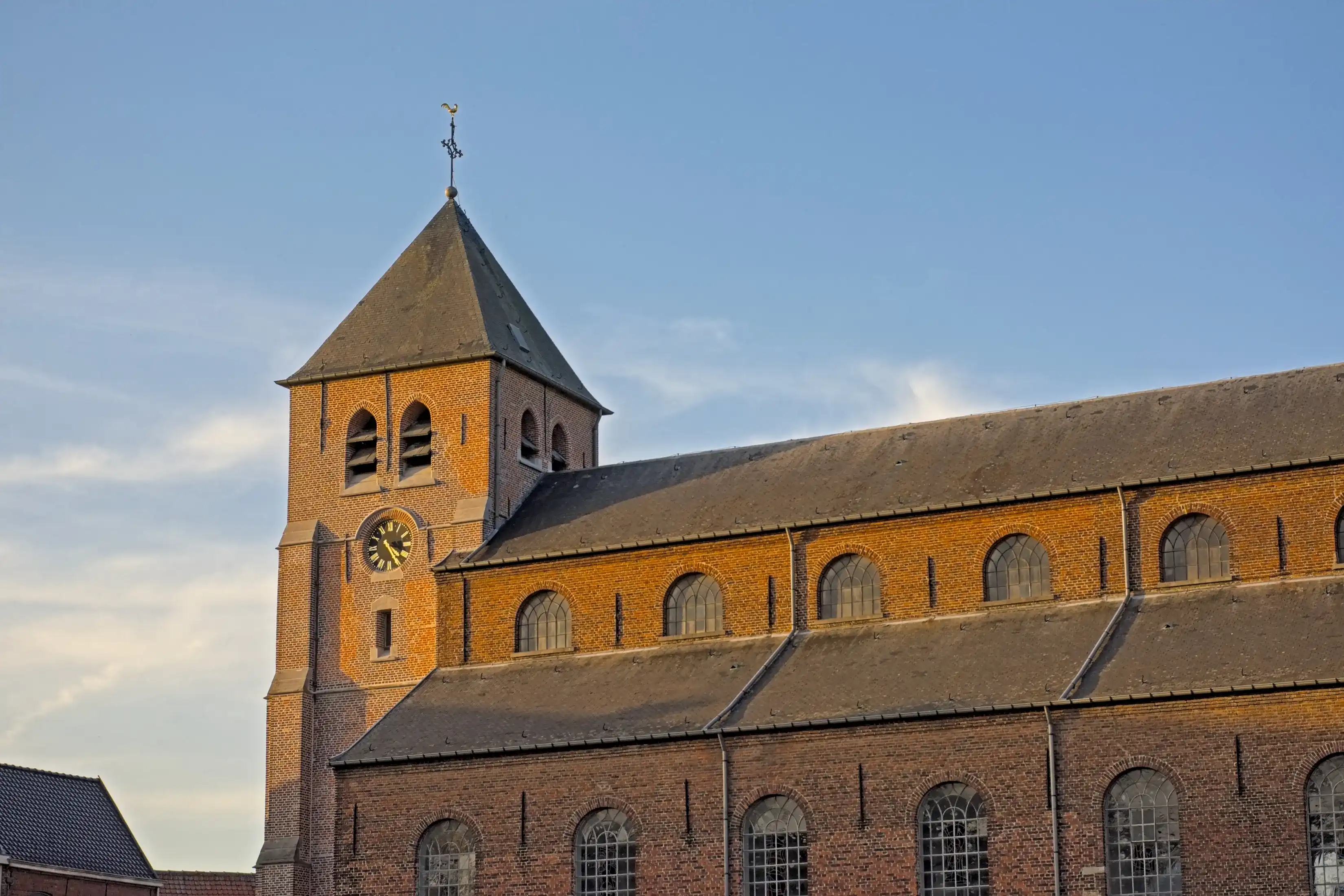 Clock tower of Saint Britius historical parish church in the village of Etikhove, Oudenaarde, Flanders, Belgium Clock tower of Saint Britius historical parish church in the village of Etikhove, Oudenaarde, Flanders, Belgium