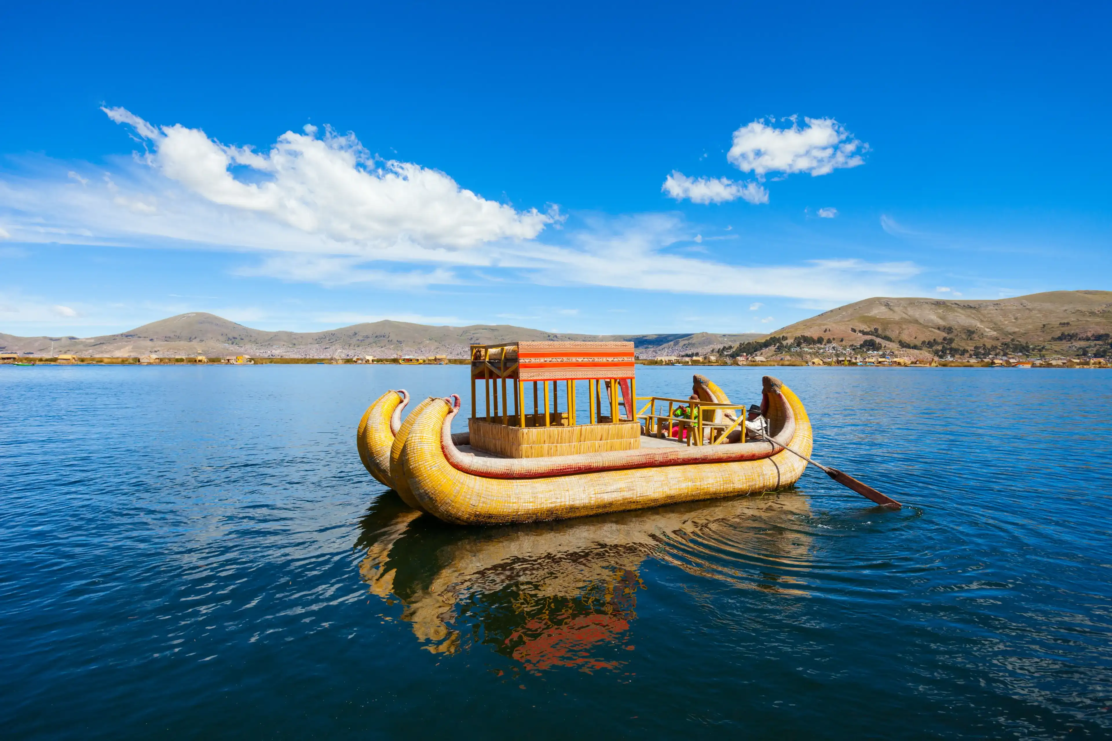 Totora boat on the Titicaca lake near Puno, Peru Totora boat on the Titicaca lake near Puno, Peru