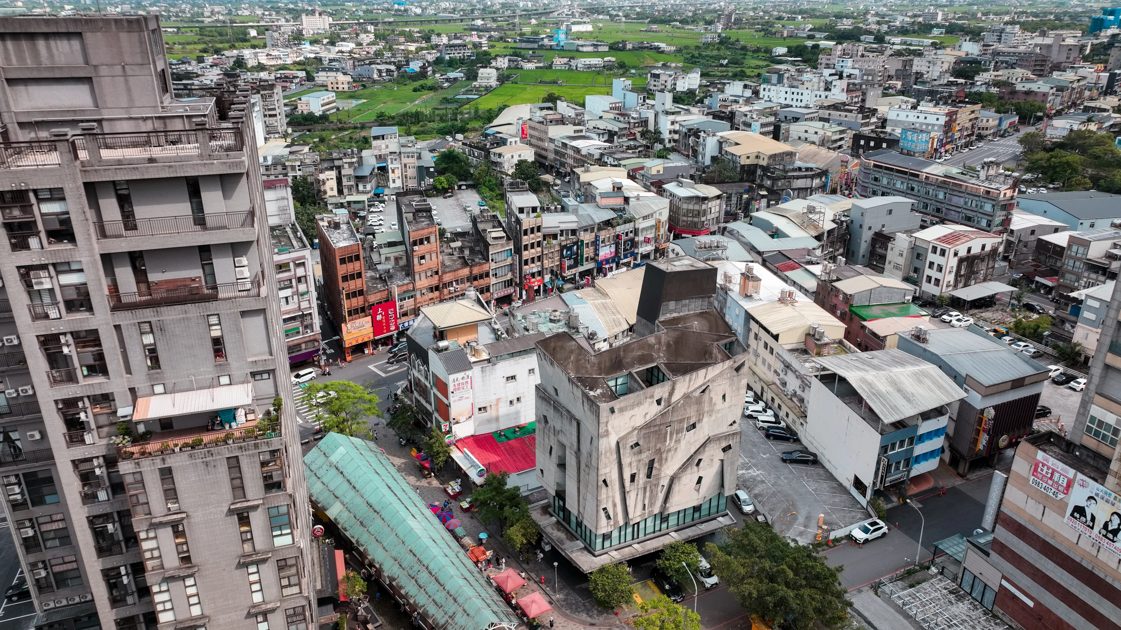 Jiaoxi, Taiwan - September 14, 2024: Aerial view of Jiaoxi City showcasing vibrant urban life and surrounding landscape in Taiwan