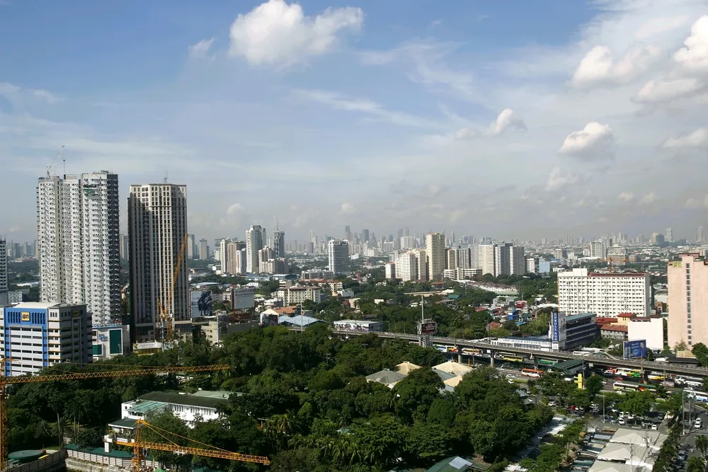 QUEZON CITY, PHILIPPINES - JULY 21, 2016: A bird's eye view of the commercial and residential buildings and structures in Quezon City, Philippines.