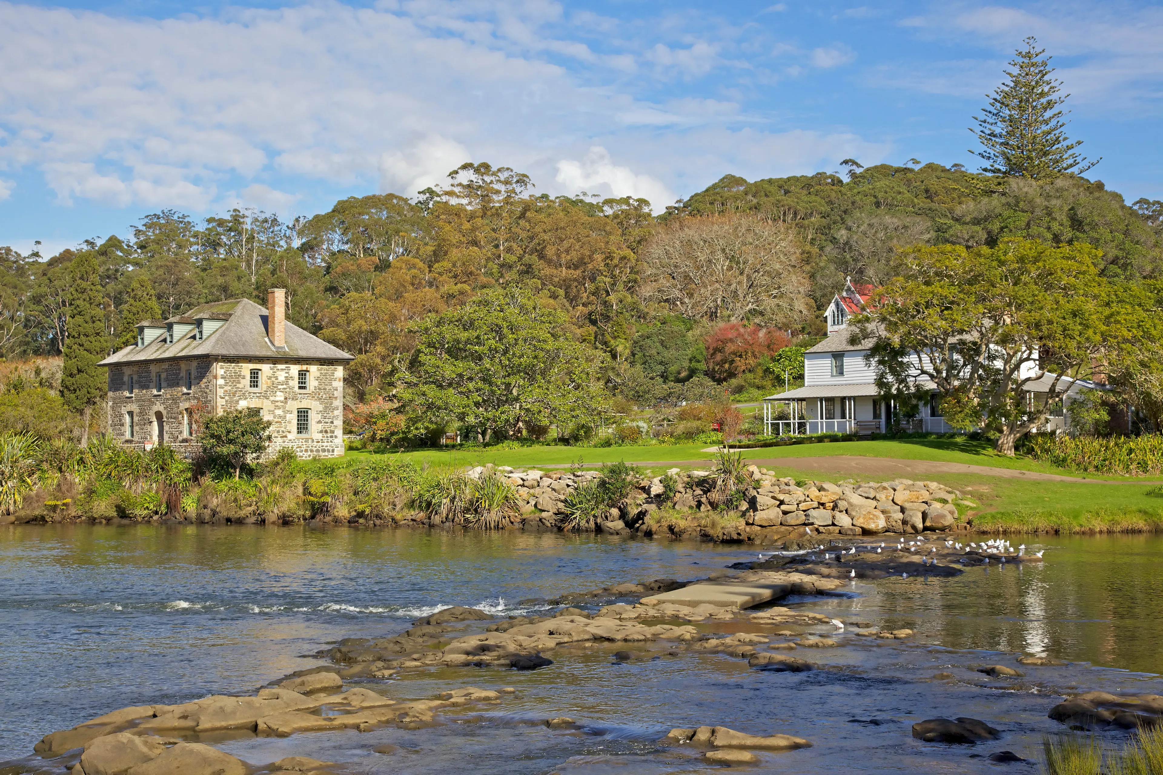 The Kerikeri Mission Station, with the Stone Store at the left, the Mission House on the right, and St James Church in the background.