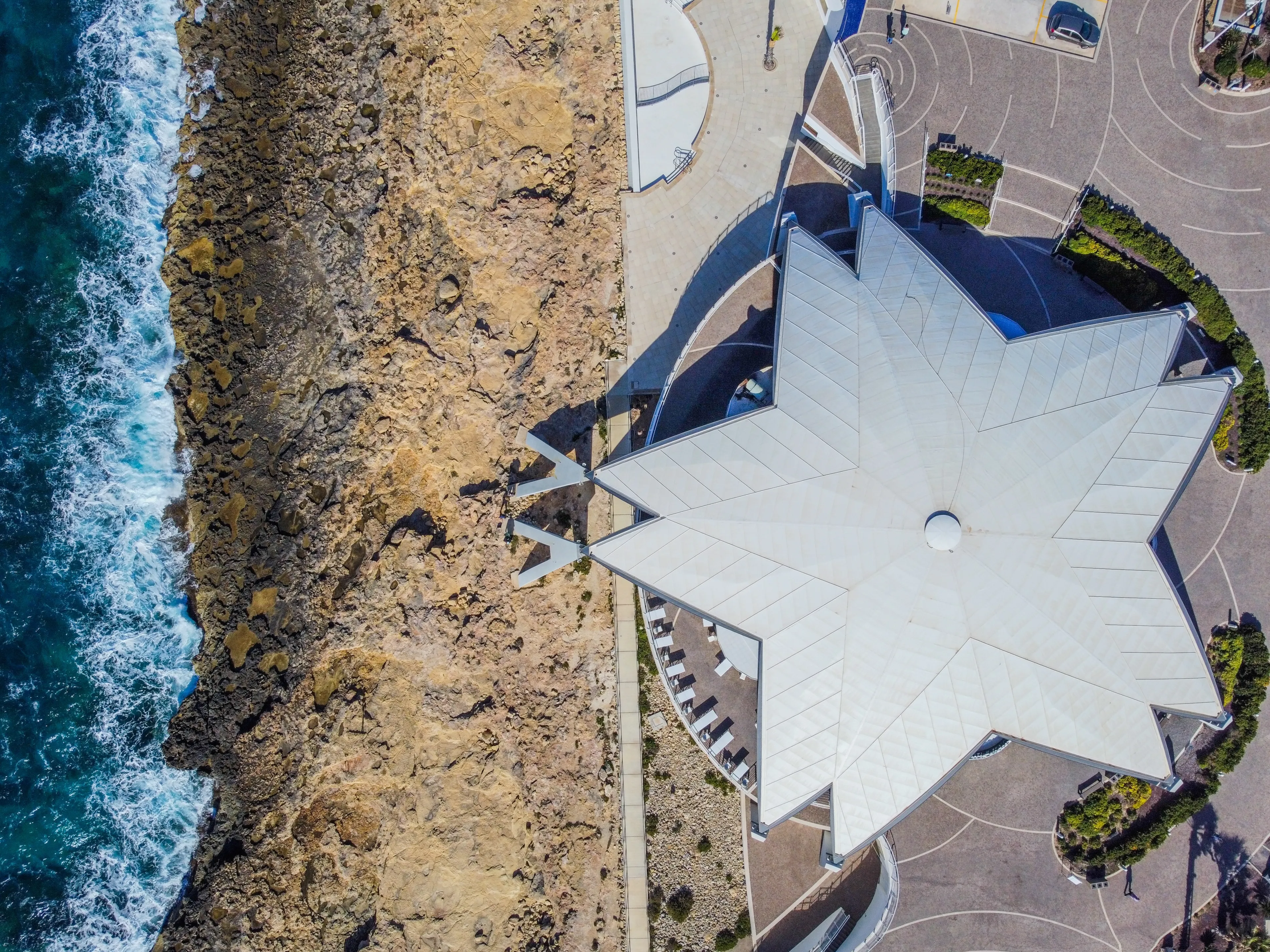 Aero Photography. View from flying drone. Panoramic cityscape of old town and an incredibly beautiful beach. San Paul il Bahar (San Pawl il-Baħar) Malta. Top view