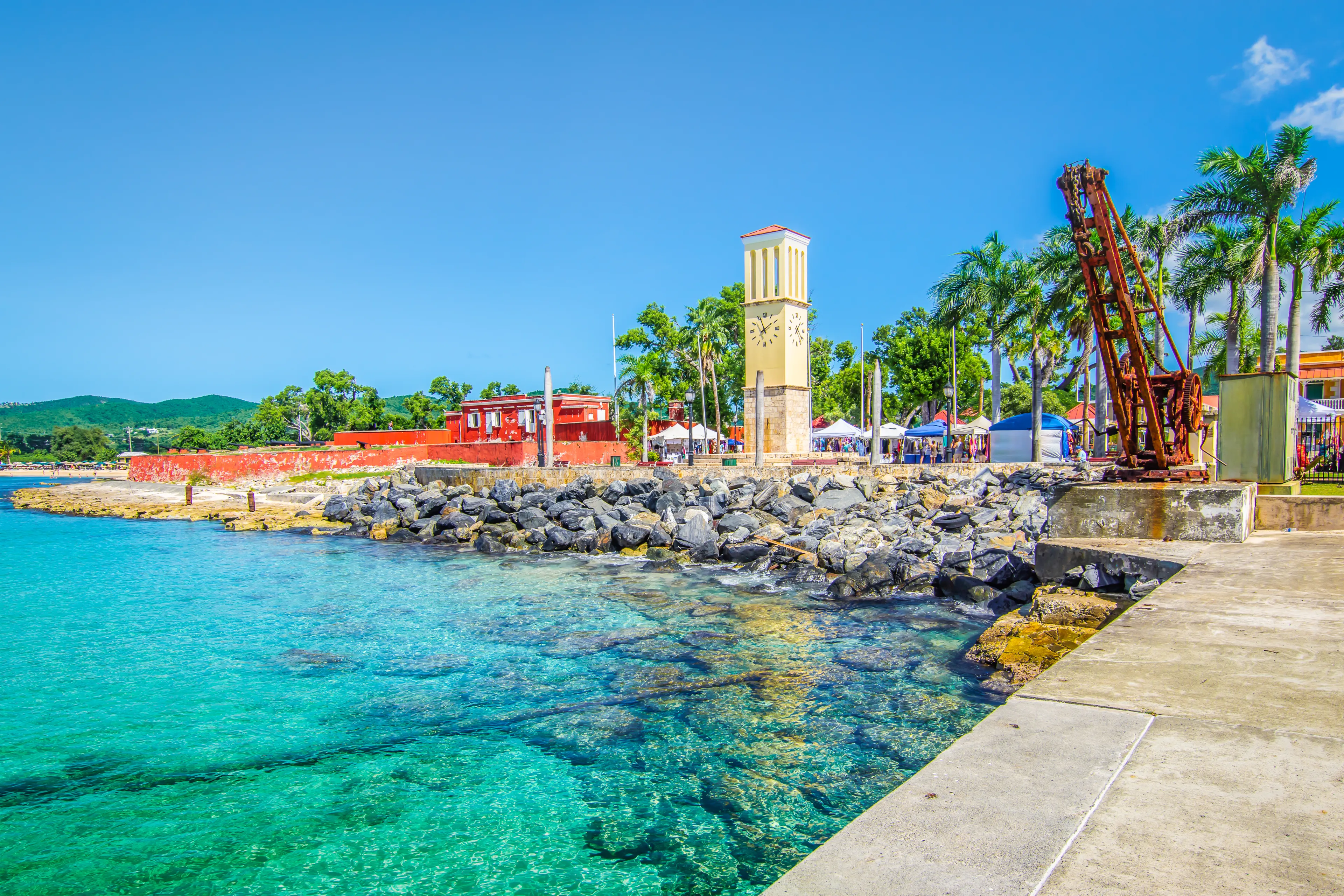 St Croix, Virgin Islands, Caribbean. Frederiksted cruise port with old Fort Frederik and clock tower at the waterfront.