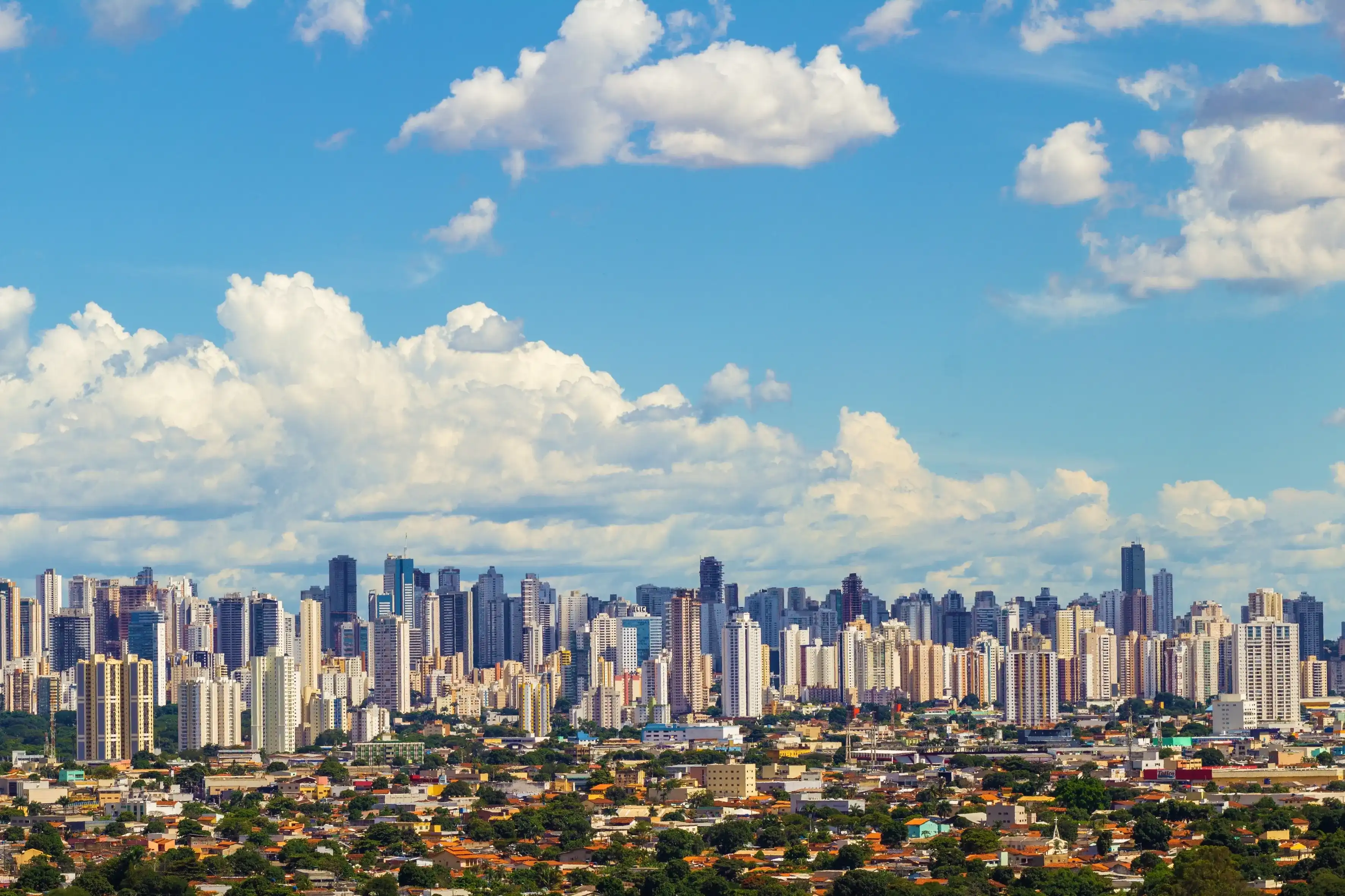 GOIÂNIA GOIAS BRAZIL – FEBRUARY 14 2023: City of Goiânia seen from Morro do Além, with many buildings and cloudy sky in the background. GOIÂNIA GOIAS BRAZIL – FEBRUARY 14 2023: City of Goiânia seen from Morro do Além, with many buildings and cloudy sky in the background.