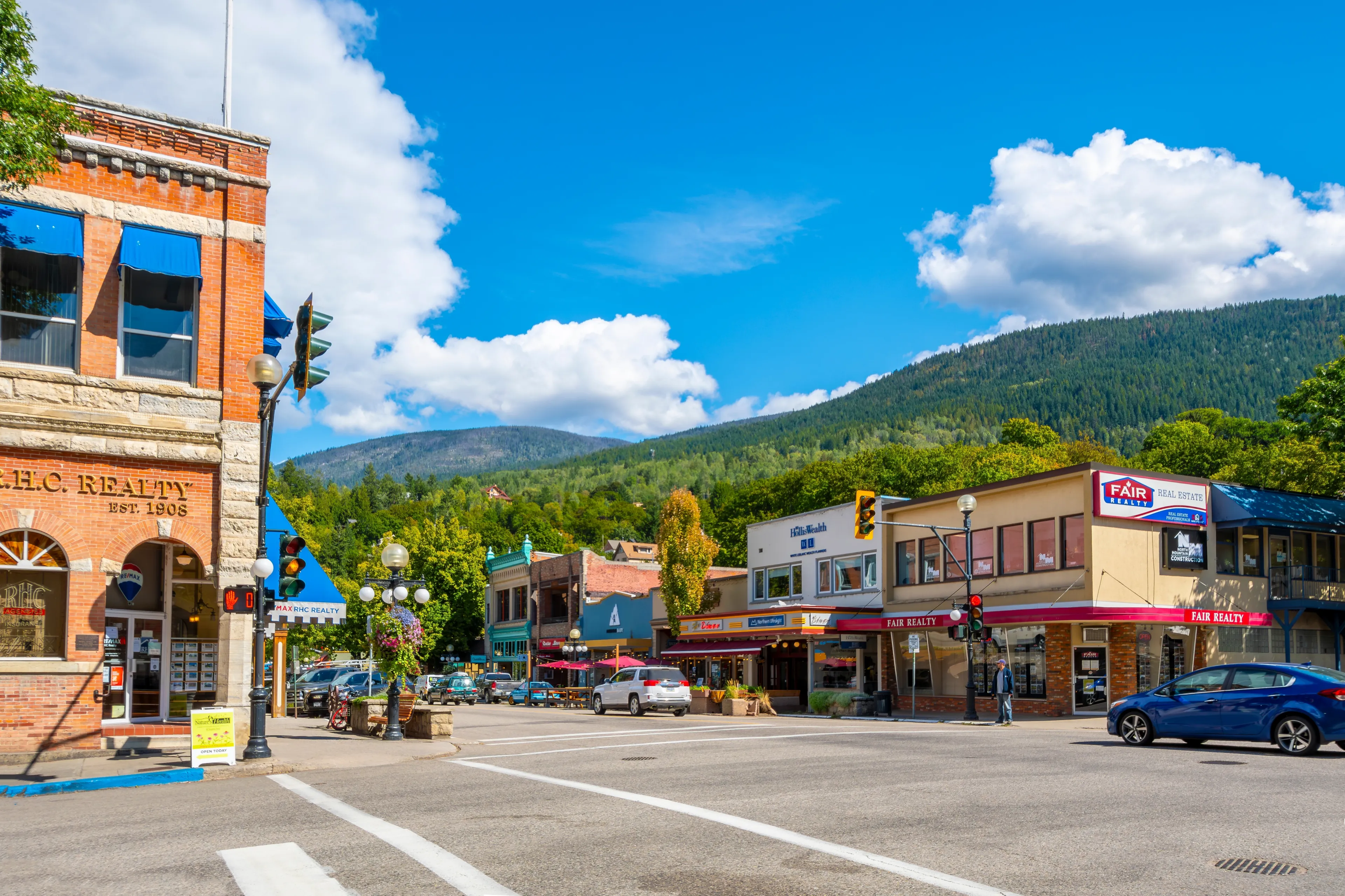 Nelson, BC, Canada - June 3 2023: The historic buildings with businesses, shops and cafes along Baker Street in the town center of Nelson, BC, Canada, in the Selkirk Mountains of British Columbia.