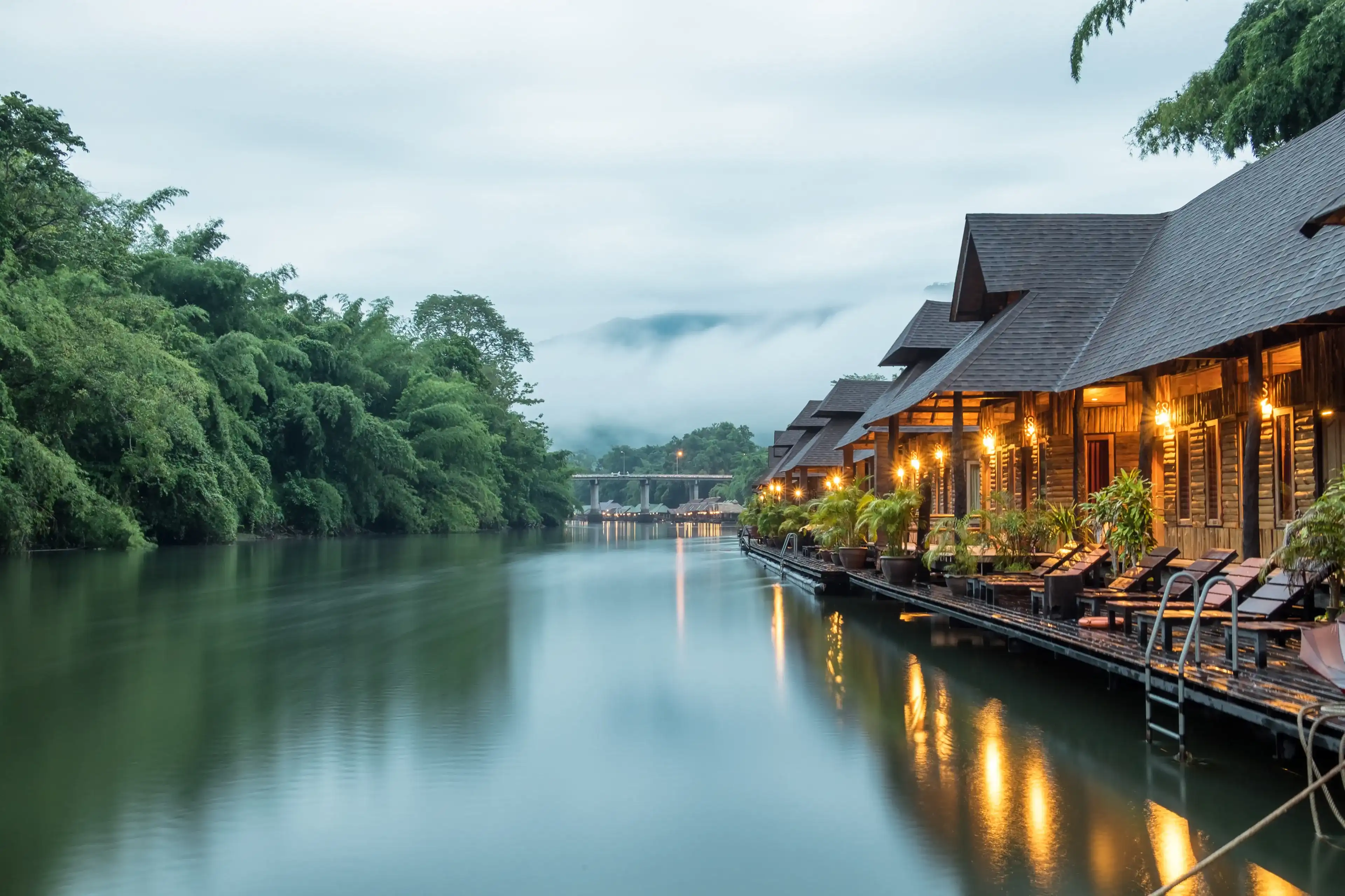 Resort wooden house floating and mountain fog on river kwai at sai yok,kanchanaburi,thailand Resort wooden house floating and mountain fog on river kwai at sai yok,kanchanaburi,thailand