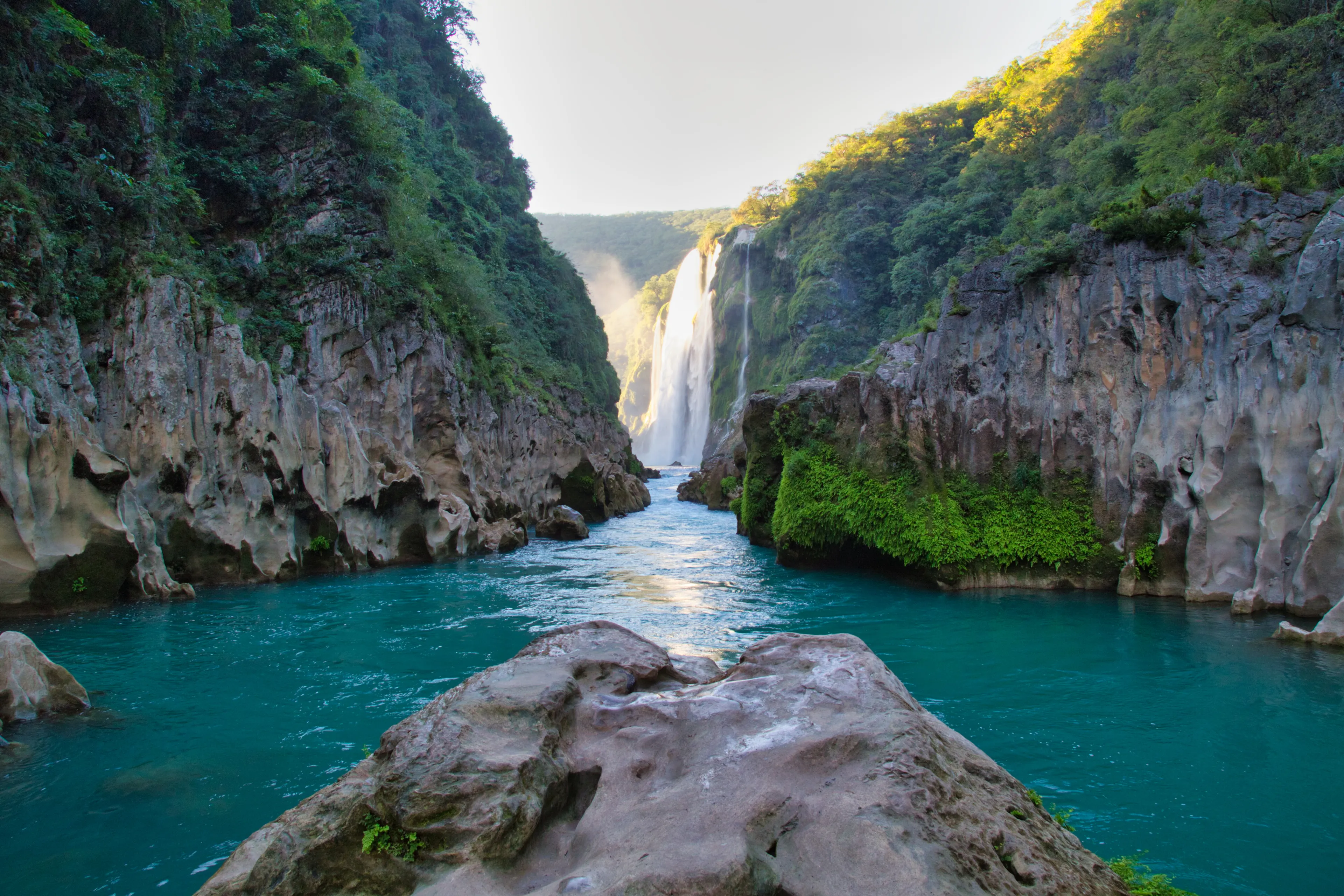 River and amazing crystalline blue water of Tamul waterfall in San Luis Potosí, Mexico