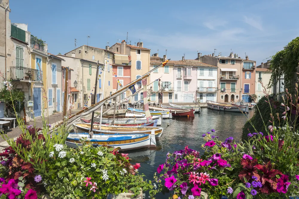 Martigues (Bouches-du-Rhone, Provence-Alpes-Cote d'Azur, France): the old harbor with boats and flowers