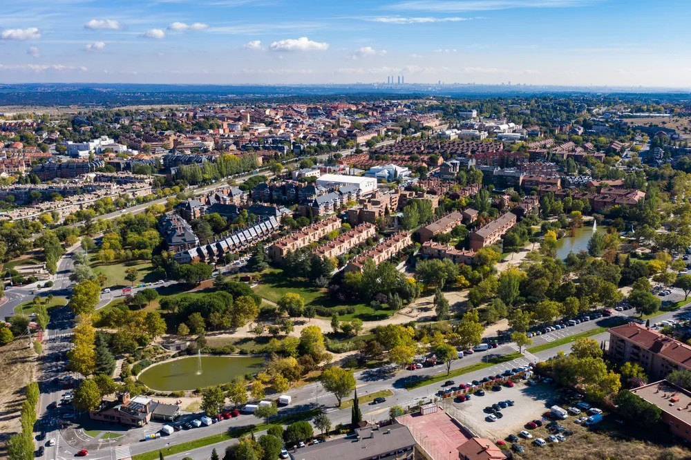 Magnificent aerial view of Las Rozas with the four towers of Madrid in the background.