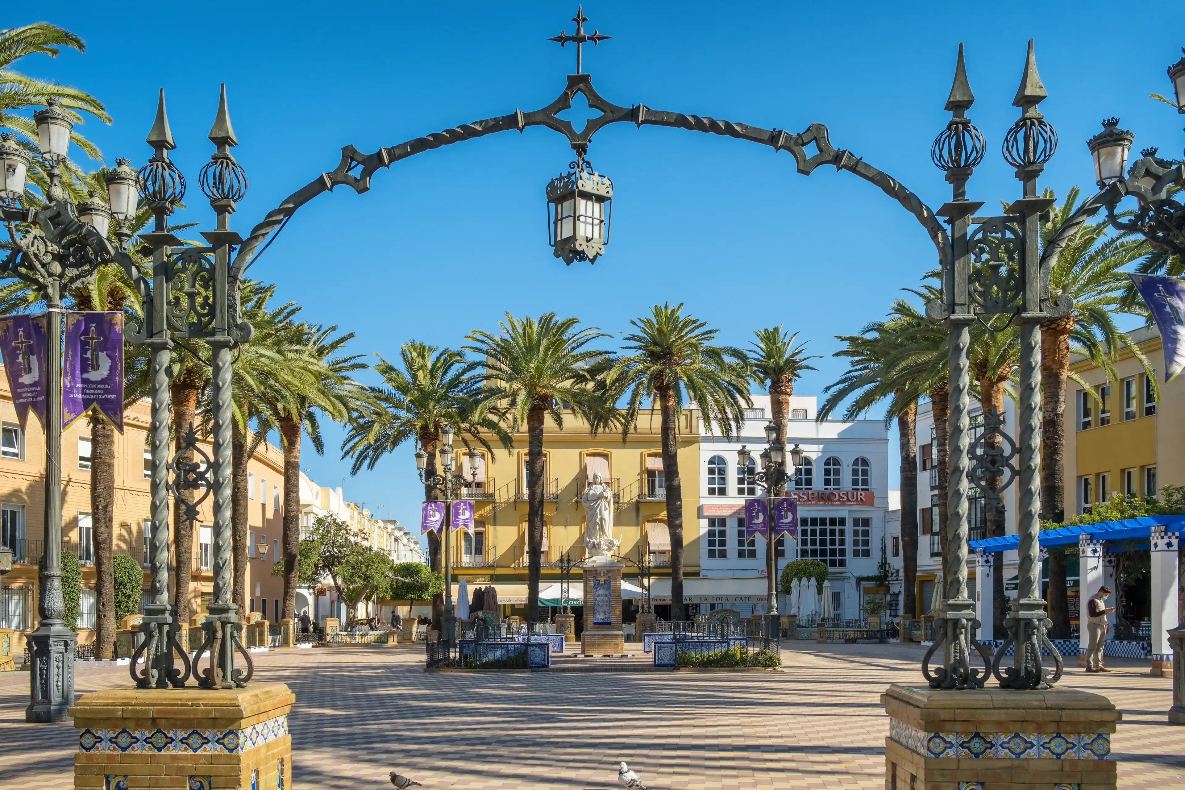 Ayamonte, Spain - April 20, 2022: Statue of the Immaculate Conception in the Plaza de la Laguna in Ayamonte town, Huelva Province, Andalucia, Spain Ayamonte, Spain - April 20, 2022: Statue of the Immaculate Conception in the Plaza de la Laguna in Ayamonte town, Huelva Province, Andalucia, Spain