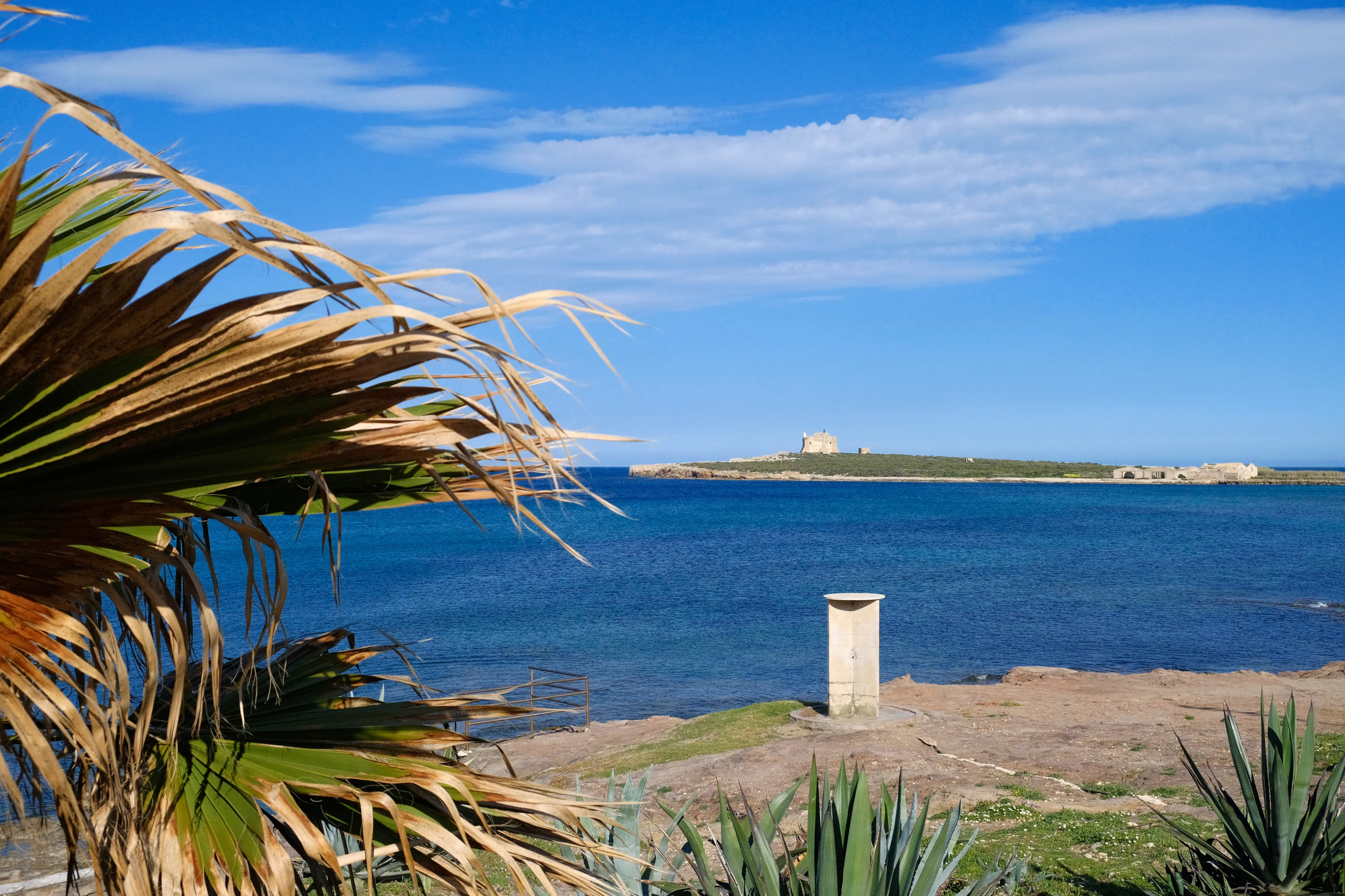 Italy, Sicily, Mediterranean Sea, Portopalo di Capo Passero, view of the rocky coast and Capo Passero Island 
