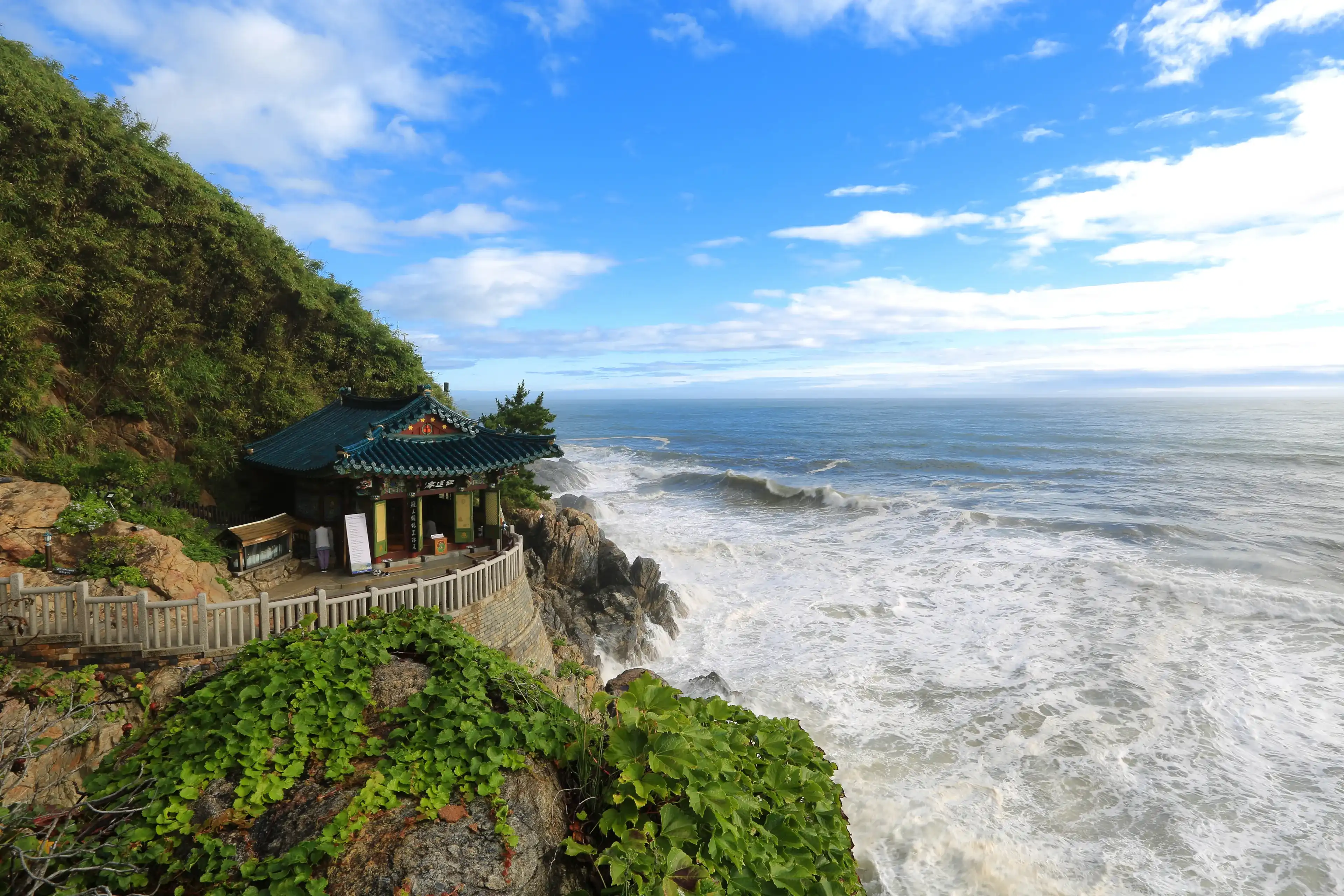Yangyang-gun, Gangwon-do, Korea - August 16, 2019:Hongnyeonam Hermitage of Naksansa Temple on cliff with big waves of the sea. This temple was built by the monk 'Uisang' of Silla era on the seashore Yangyang-gun, Gangwon-do, Korea - August 16, 2019:Hongnyeonam Hermitage of Naksansa Temple on cliff with big waves of the sea. This temple was built by the monk 'Uisang' of Silla era on the seashore