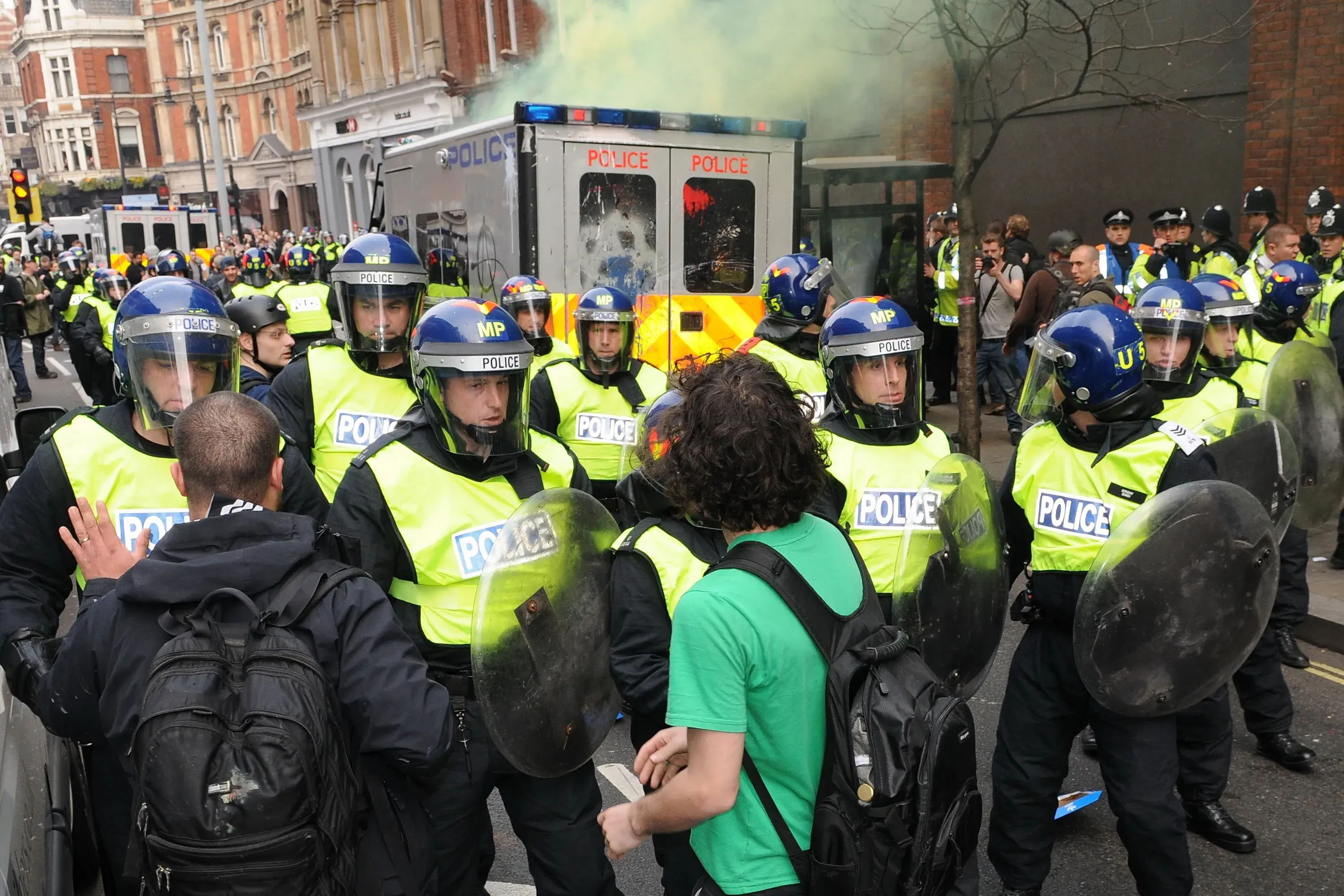 Police in riot gear confront protesters in central London during large a anti government rally on March 26, 2011 in London, UK. Arrests were made after protesters clashed with police across the city. Police in riot gear confront protesters in central London during large a anti government rally on March 26, 2011 in London, UK. Arrests were made after protesters clashed with police across the city.