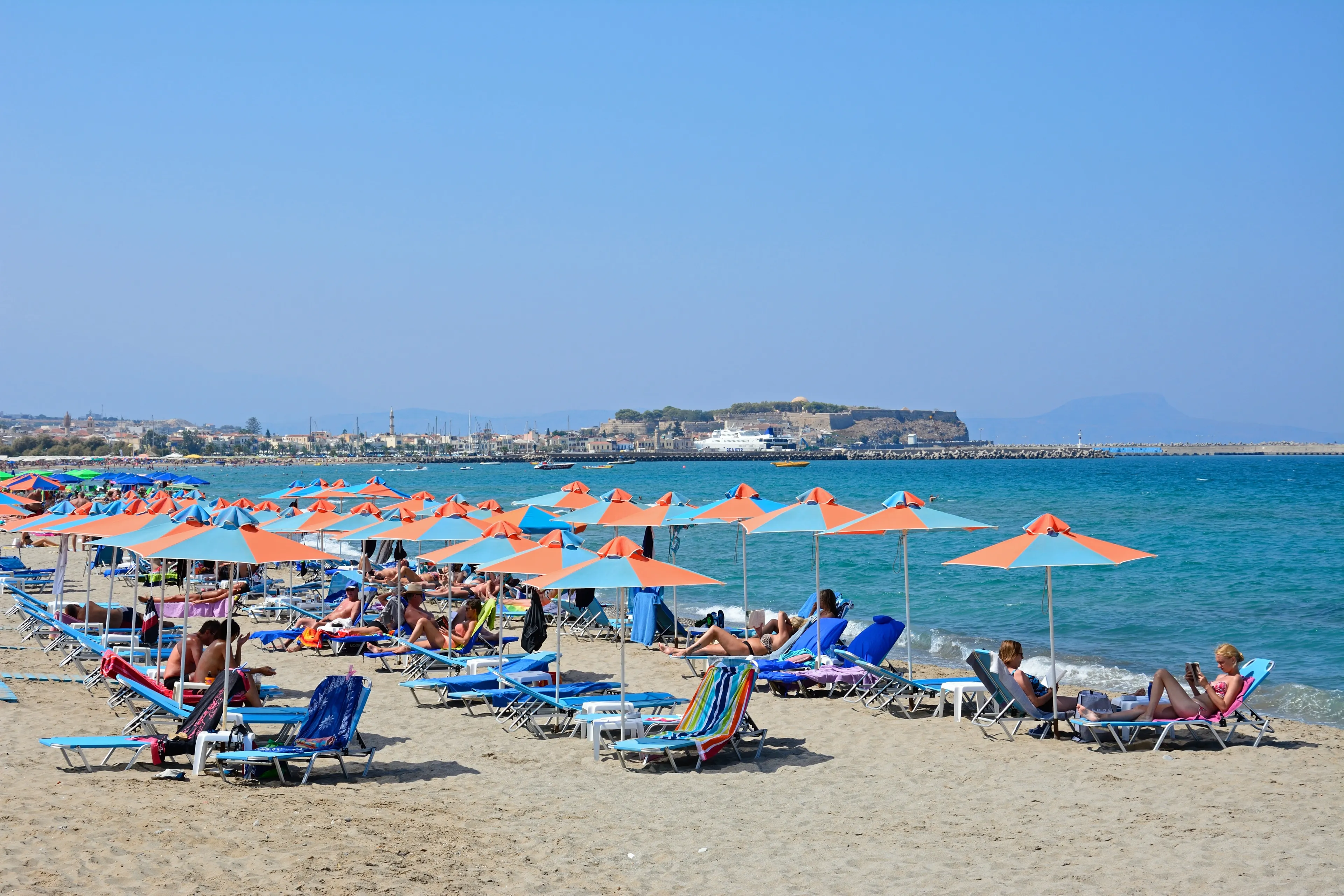 PERIVOLIA, CRETE - SEPTEMBER 15, 2016 - Tourists relaxing on the sandy beach, Perivolia, Crete, Greece, Europe, September 15, 2016.