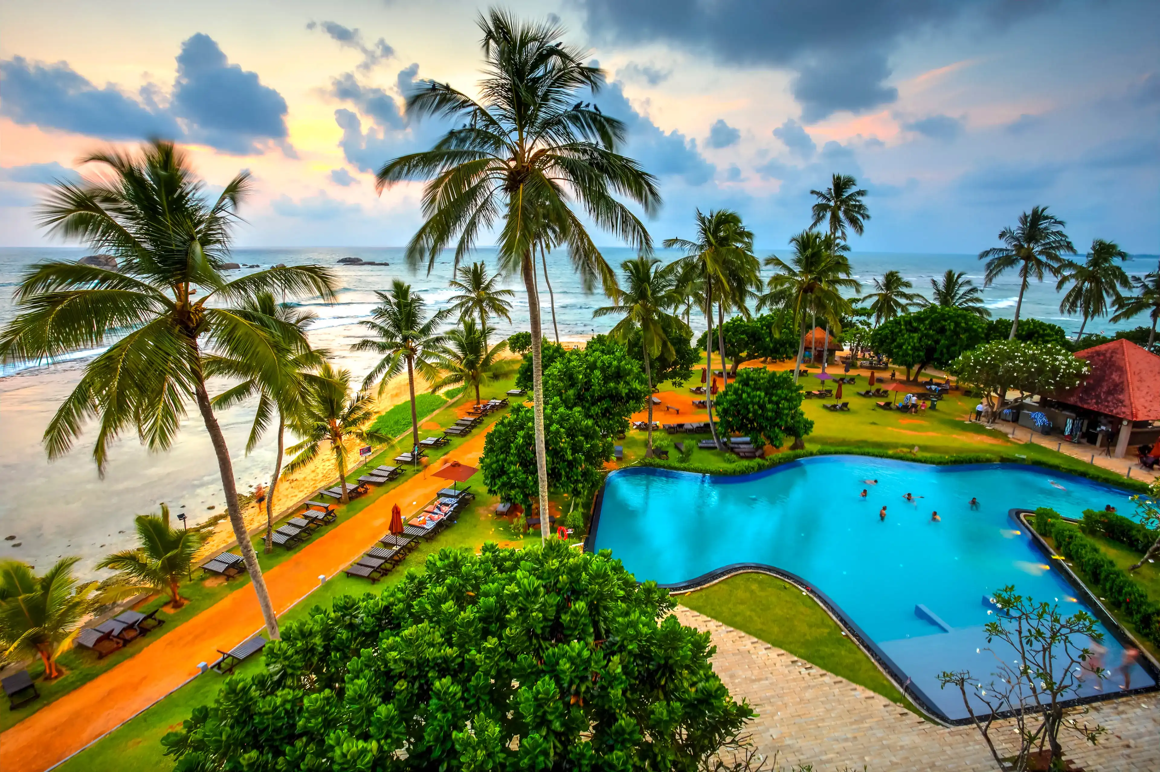 Hikkaduwa Beach seen at sunset from a balcony of a hotel resort, Sri Lanka. Hikkaduwa Beach seen at sunset from a balcony of a hotel resort, Sri Lanka.
