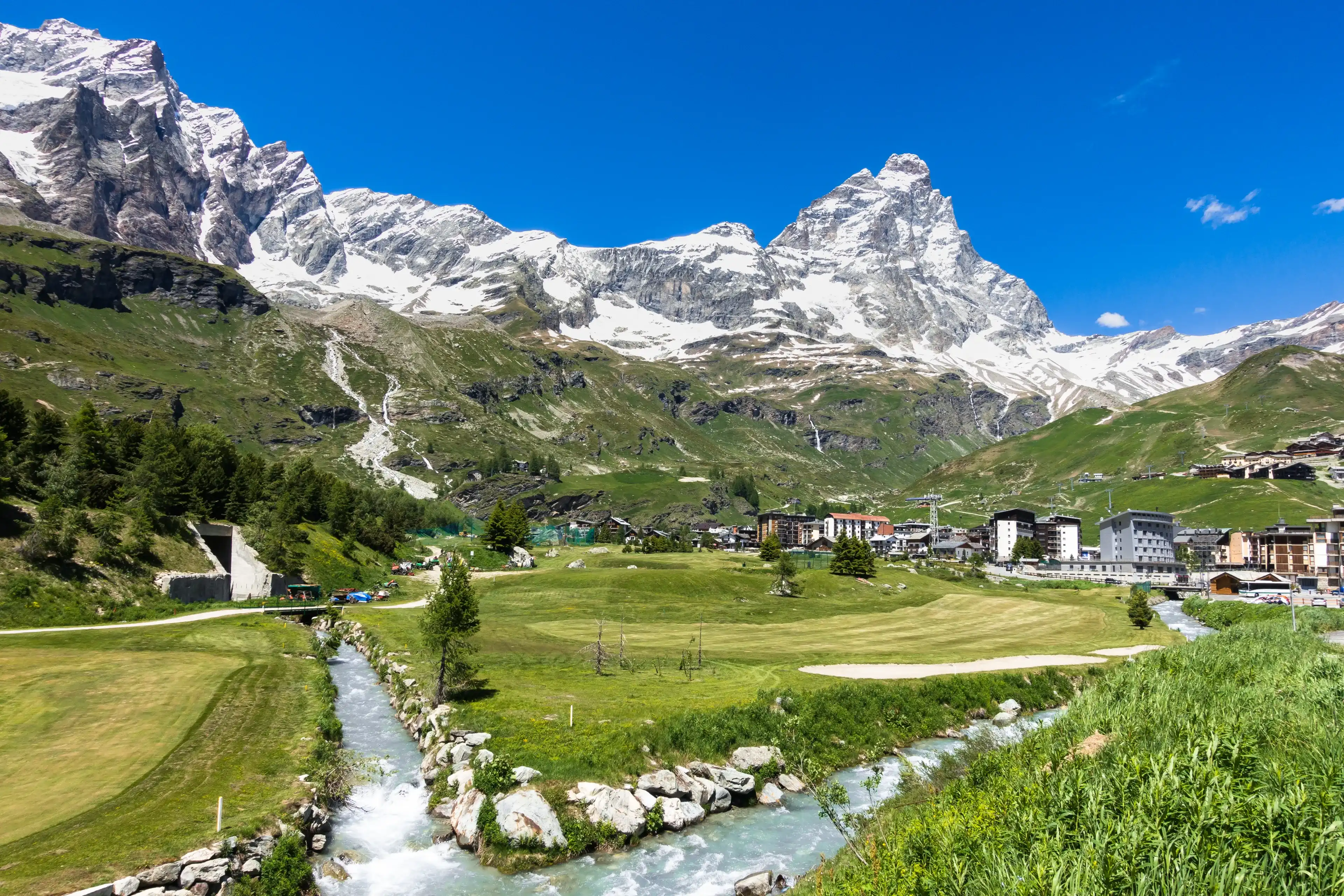 Summer panorama of Breuil-Cervinia an alpine resort town at the foot of the Matterhorn (Cervino), Aosta Valley, northern Italy Summer panorama of Breuil-Cervinia an alpine resort town at the foot of the Matterhorn (Cervino), Aosta Valley, northern Italy