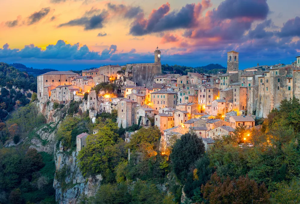 Panoramic view of Sorano in the evening sunset with old tradition buildings and illumination. Old small town in the Province of Grosseto, Tuscany (Toscana), Italy.