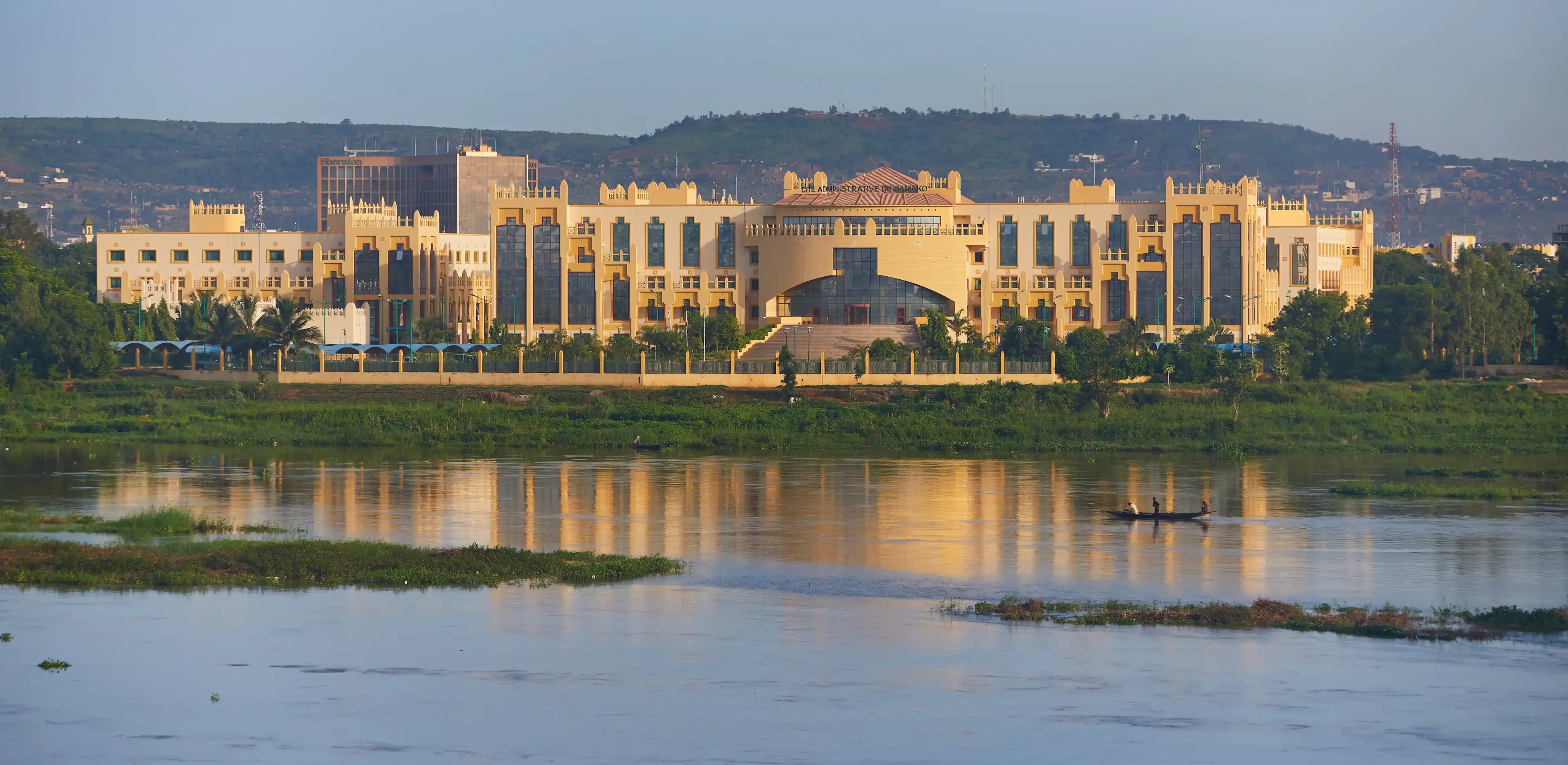 Mali, Bamako – July 08, 2018: Panoramic Niger river view onto Cite Administrative De Bamako building. Mali, Bamako – July 08, 2018: Panoramic Niger river view onto Cite Administrative De Bamako building.