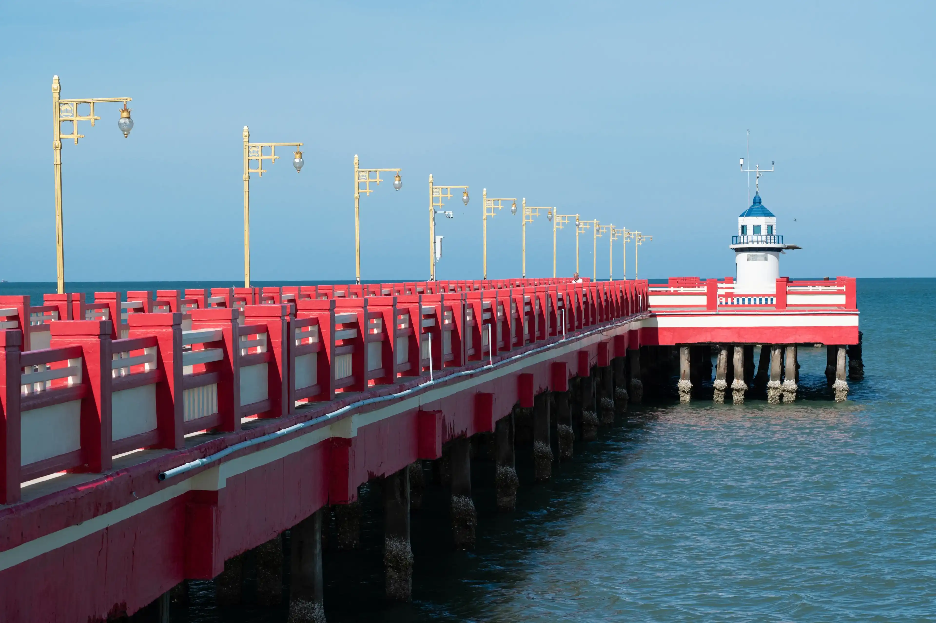 Red Bridge at Prachuap bay,Muang district,Prachuap Khiri Khan Province, Thailand. Name of Bridge is Saranvithi.Landmark of Prachuapkhirikhan province. Red Bridge at Prachuap bay,Muang district,Prachuap Khiri Khan Province, Thailand. Name of Bridge is Saranvithi.Landmark of Prachuapkhirikhan province.