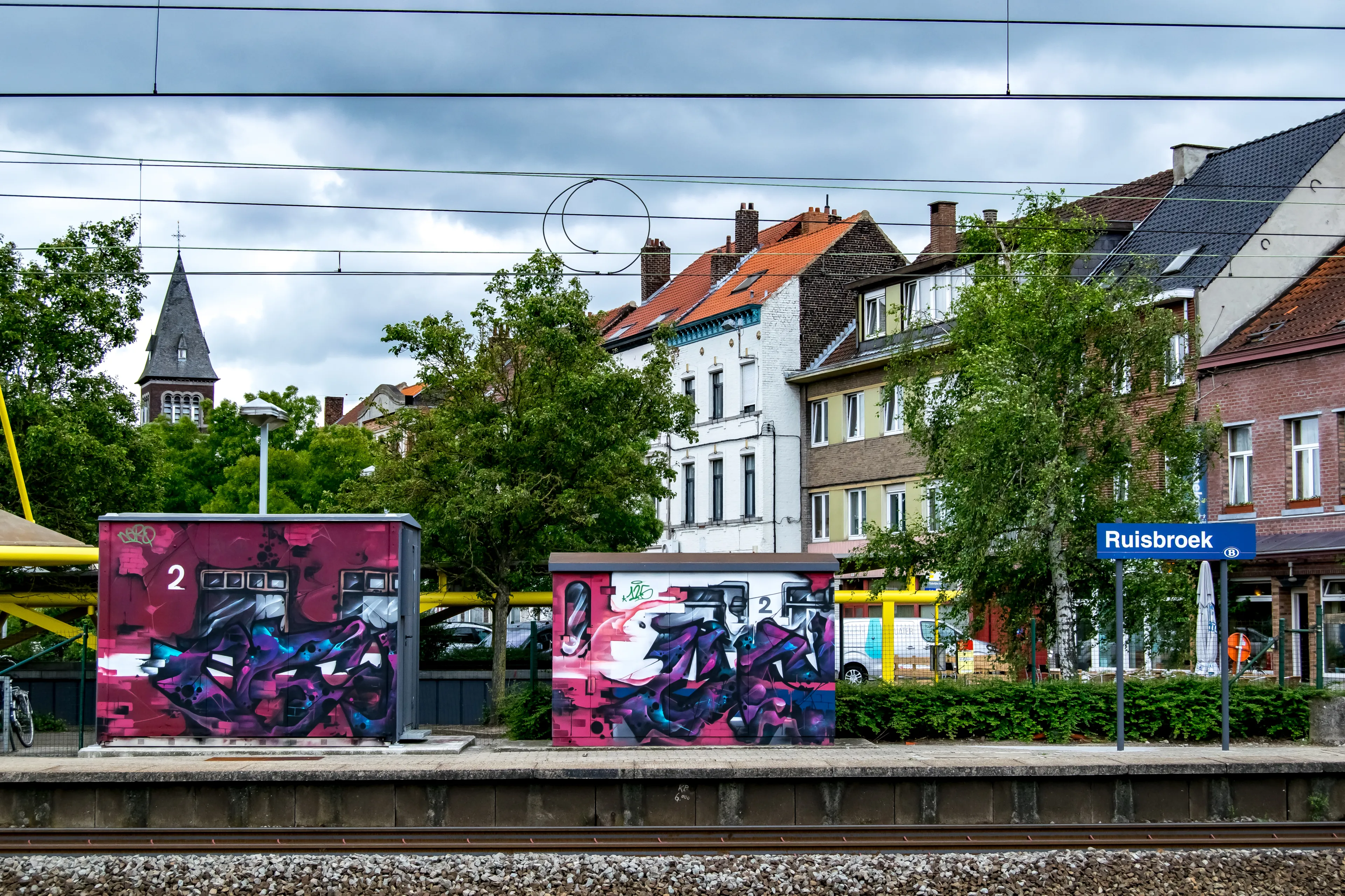 RUISBROEK, BELGIUM, JUNE 12, 2017: VEIWS FROM THE PASSENGER PLATFORM AT THE STATION IN RUISBROEK, BELGIUM ON JUNE 12, 2017