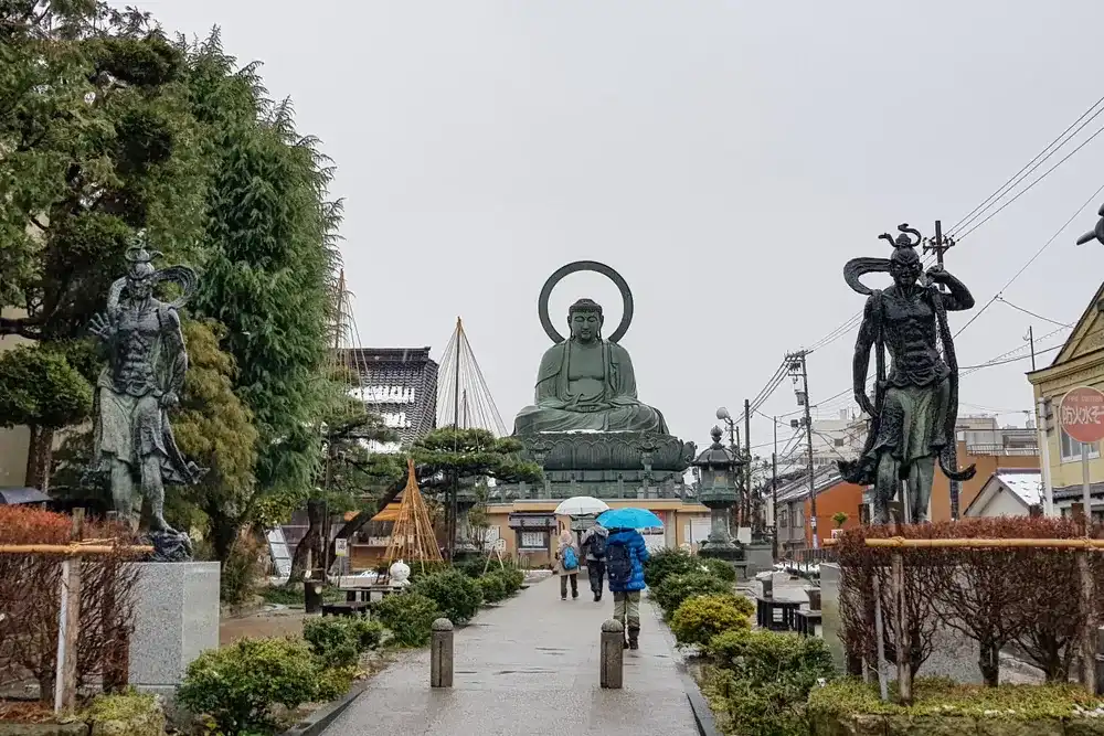TAKAOKA, JAPAN - Jan 28, 2019 : Takaoka Daibutsu Is One Of The Three Great Image Of Buddha In Japan. Big Buddha In Toyama Prefecture, Japan. TAKAOKA, JAPAN - Jan 28, 2019 : Takaoka Daibutsu Is One Of The Three Great Image Of Buddha In Japan. Big Buddha In Toyama Prefecture, Japan.