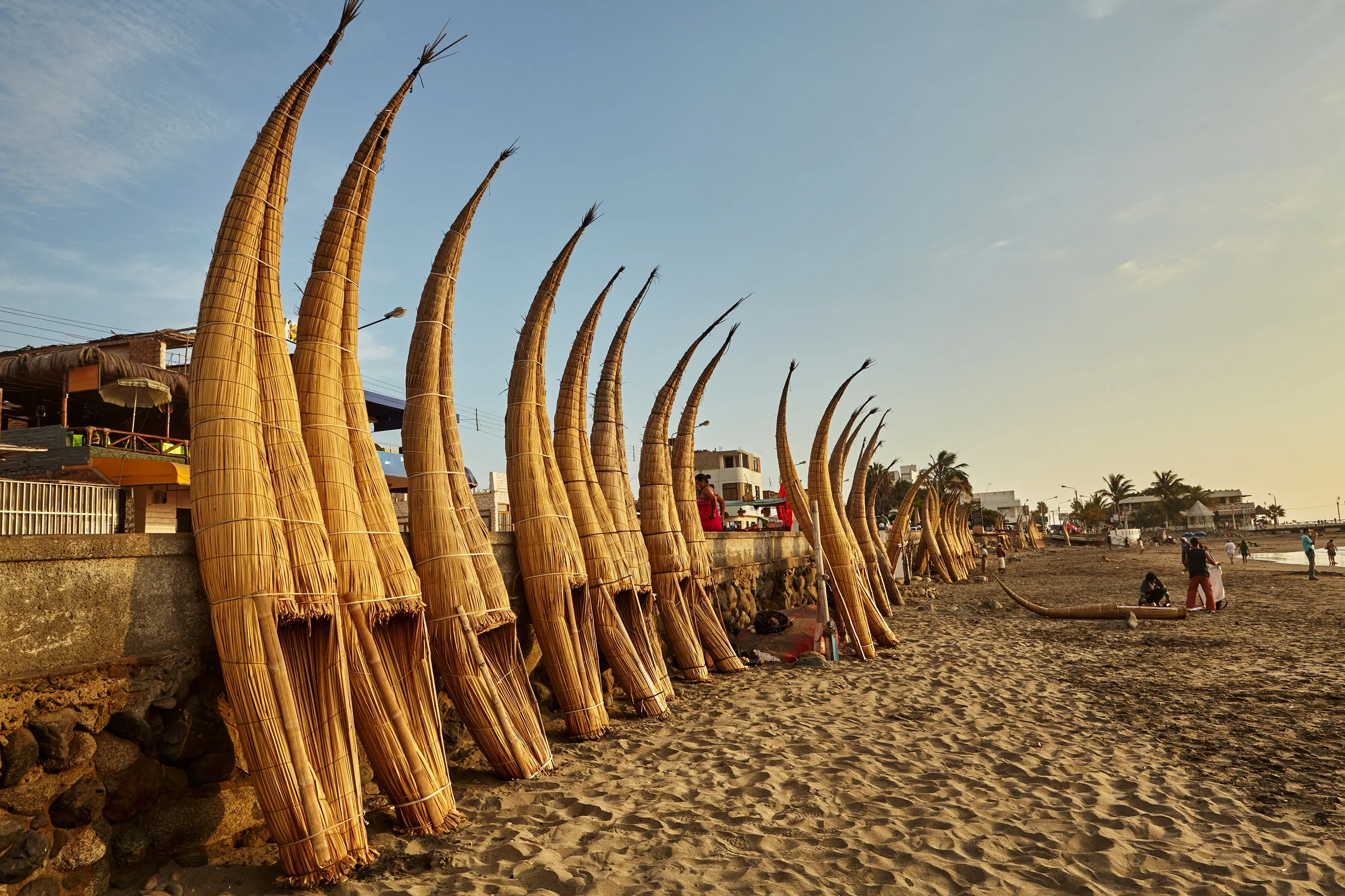 These reed boats are called "caballitos de totora" because of their shape, which resembles a horse. They have been used for thousands of years by the local fishermen in Huanchaco.