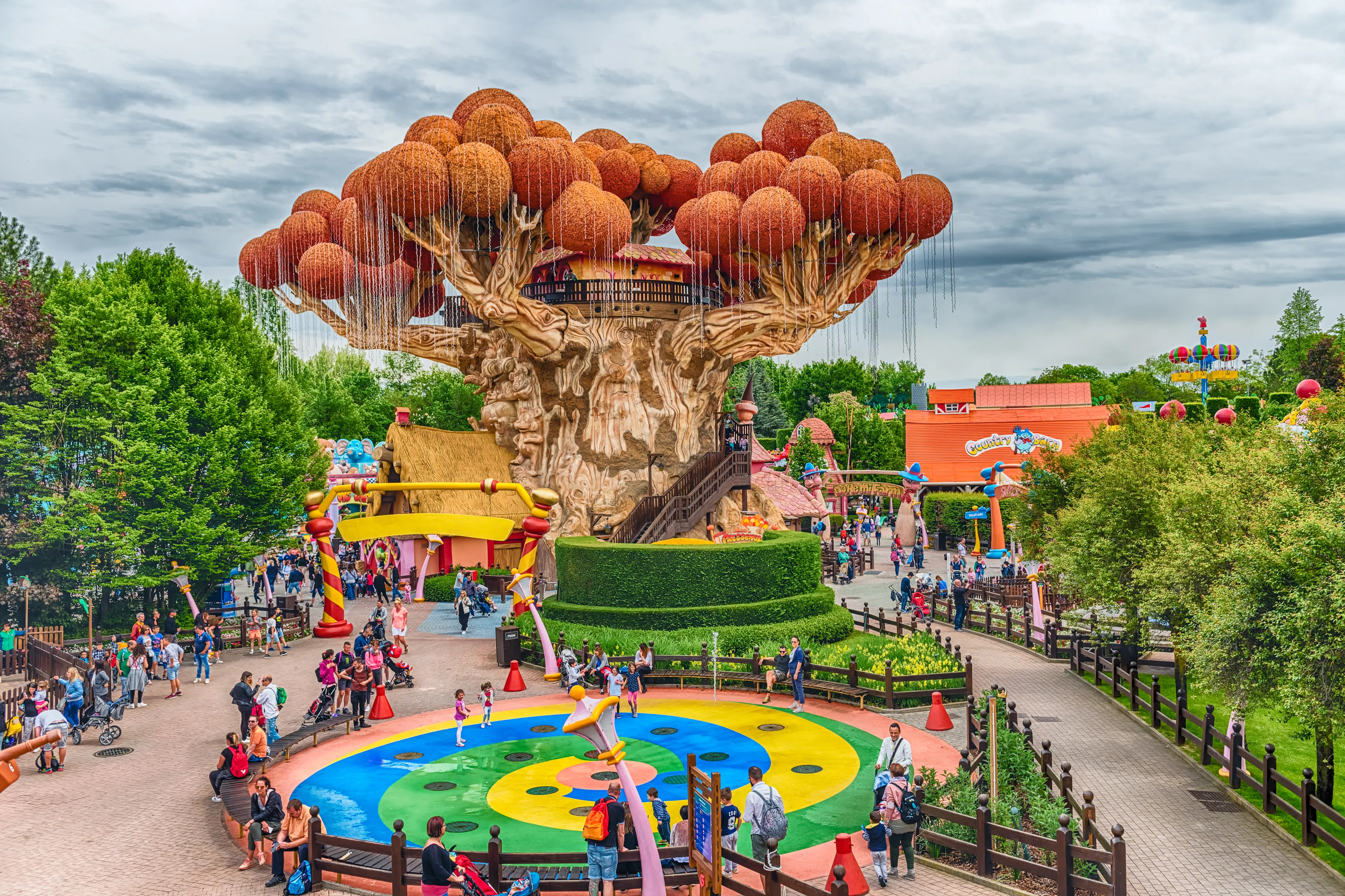 CASTELNUOVO DEL GARDA, ITALY - MAY 1: Giant tree inside Gardaland Amusement Park, near Lake Garda, Italy, May 1, 2018. The park attracts nearly 3 million visitors every year