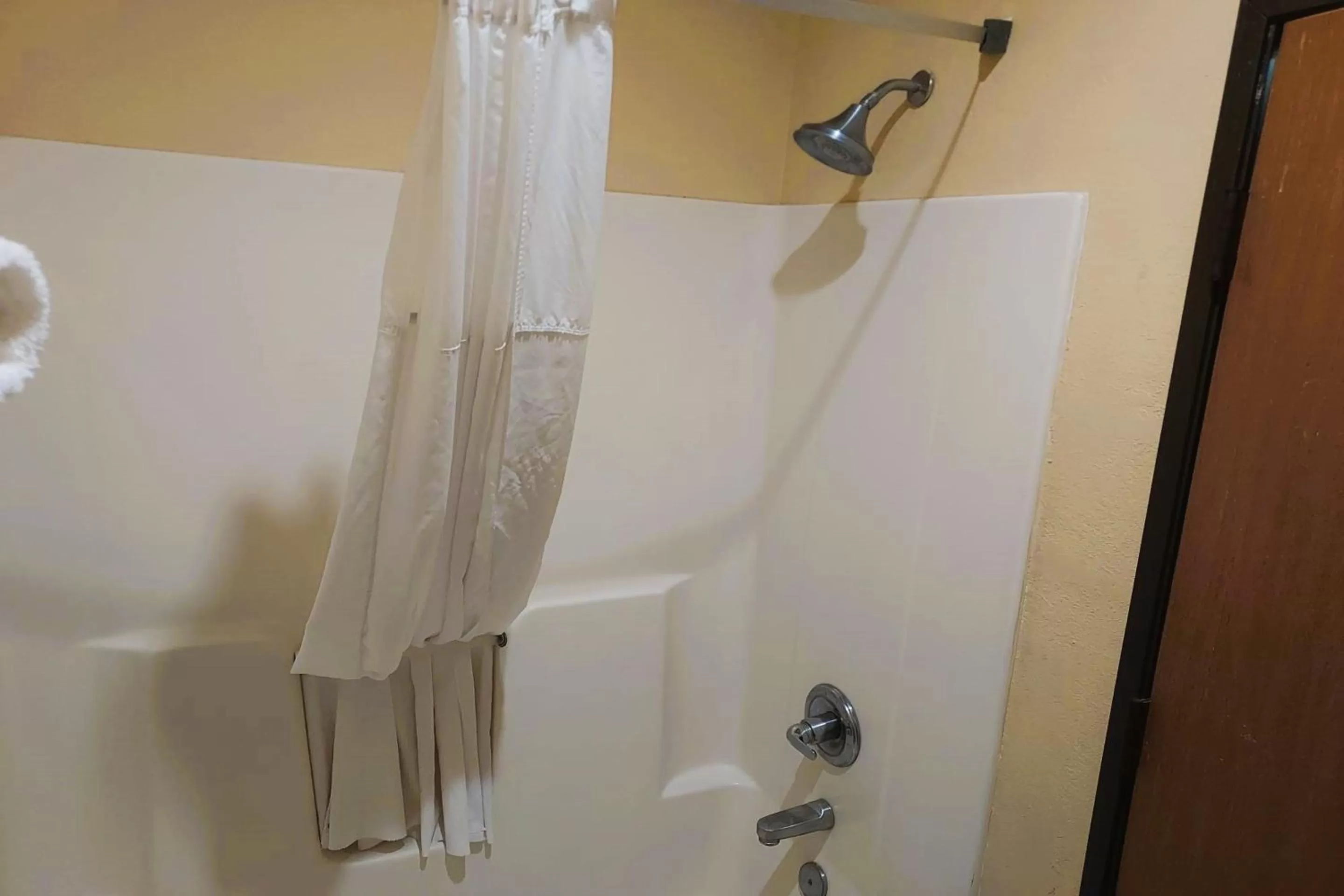 Bathroom in McPherson Inn By OYO, I-135