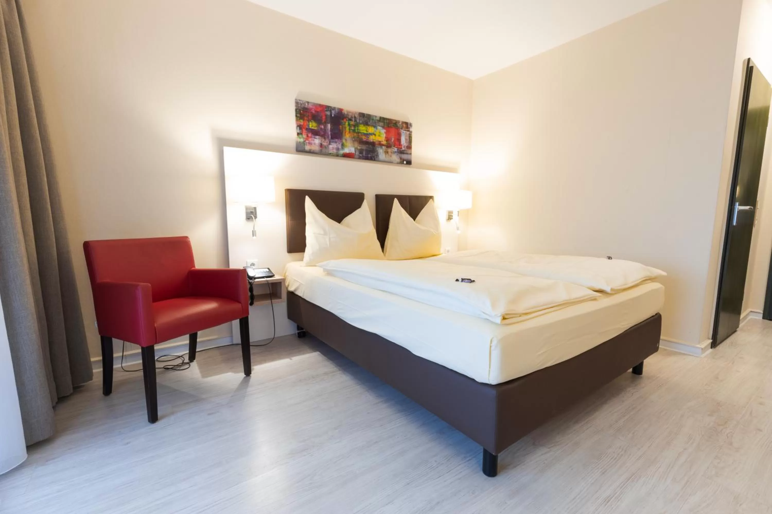 Photo of the whole room, Bed in Montana Landhotel Gummersbach-Nord