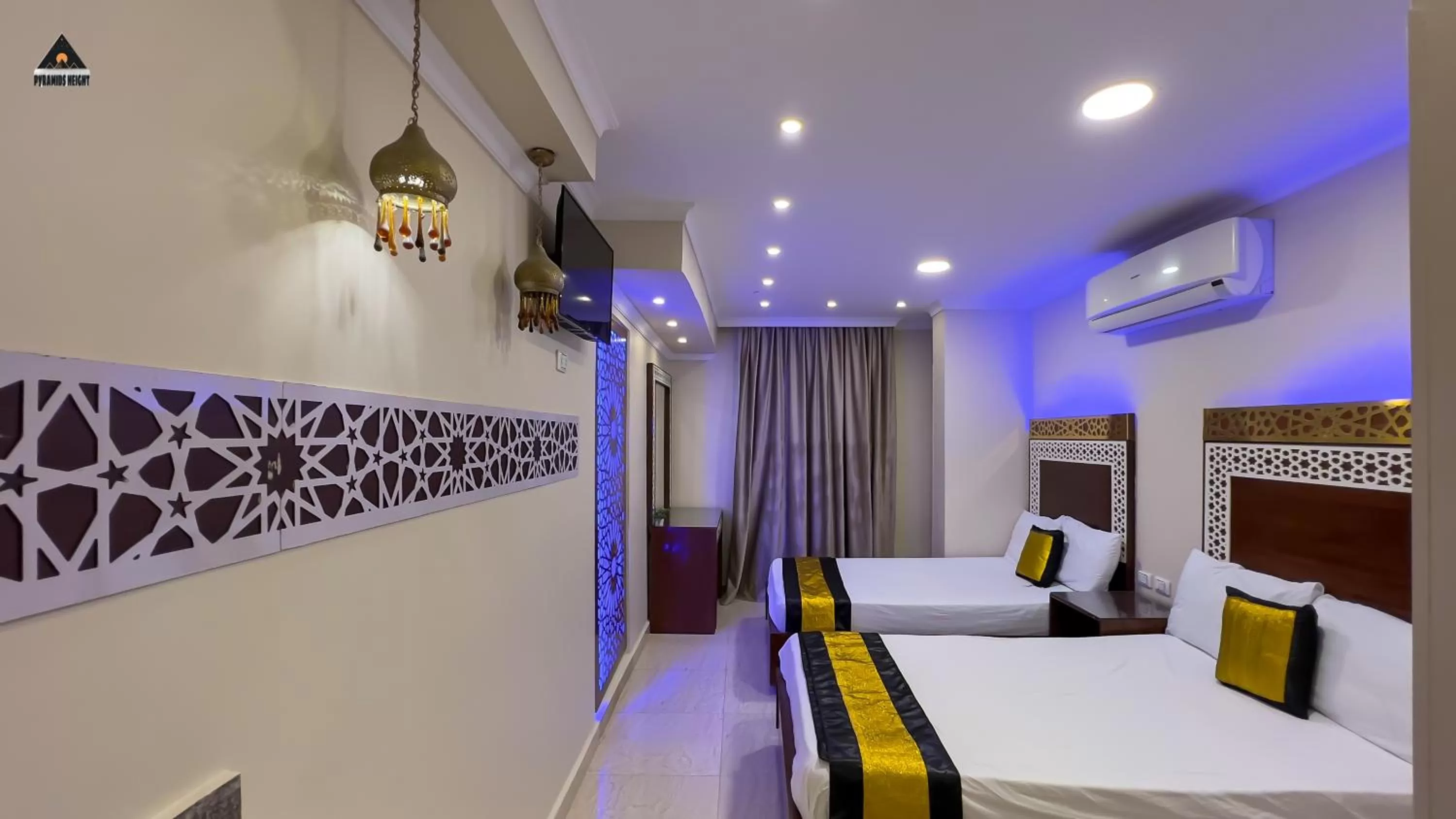 Bed in Pyramids Height Hotel & Pyramids Master Scene Rooftop