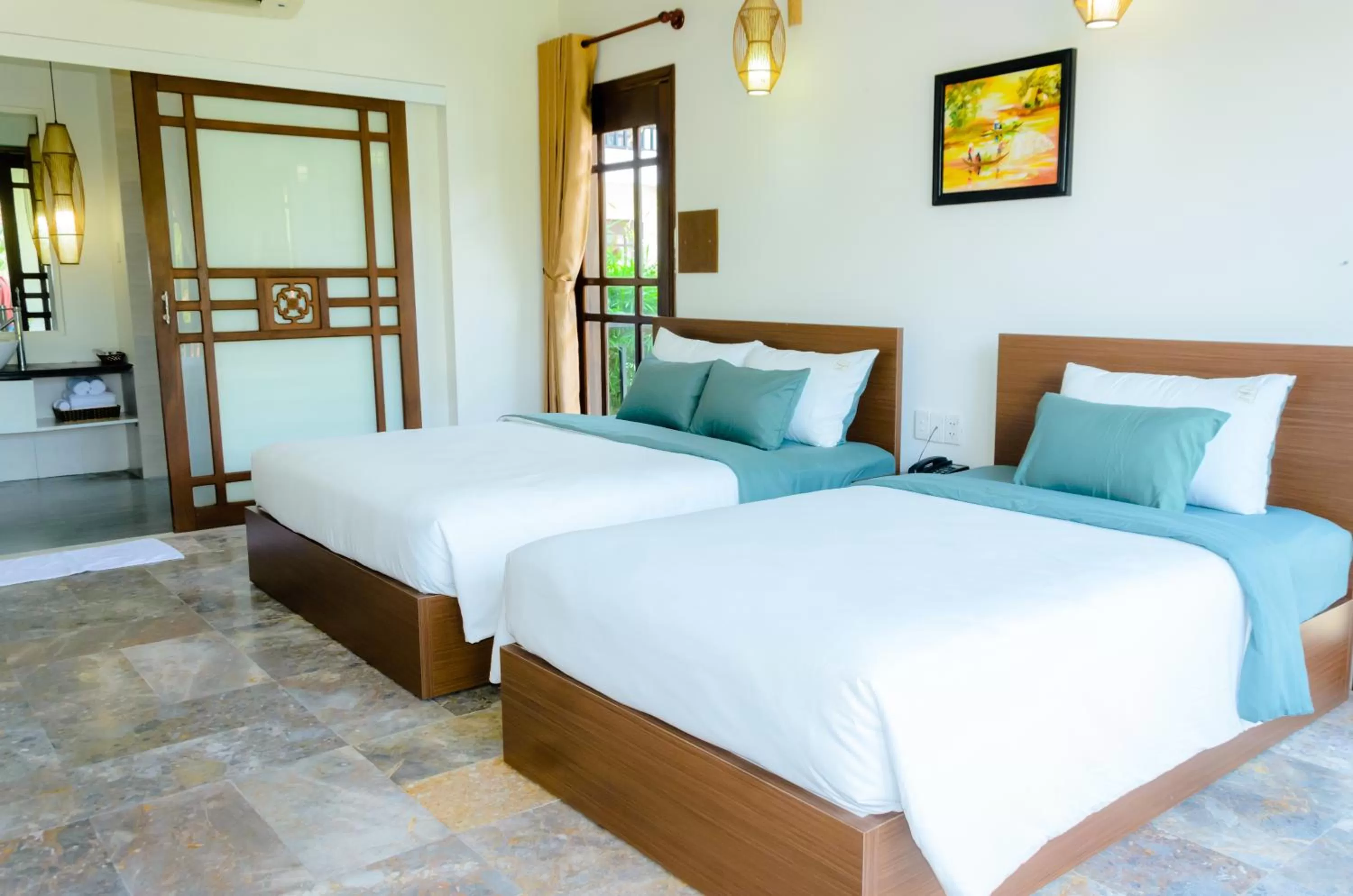 Bed in Riverside Bamboo Resort Hoi An