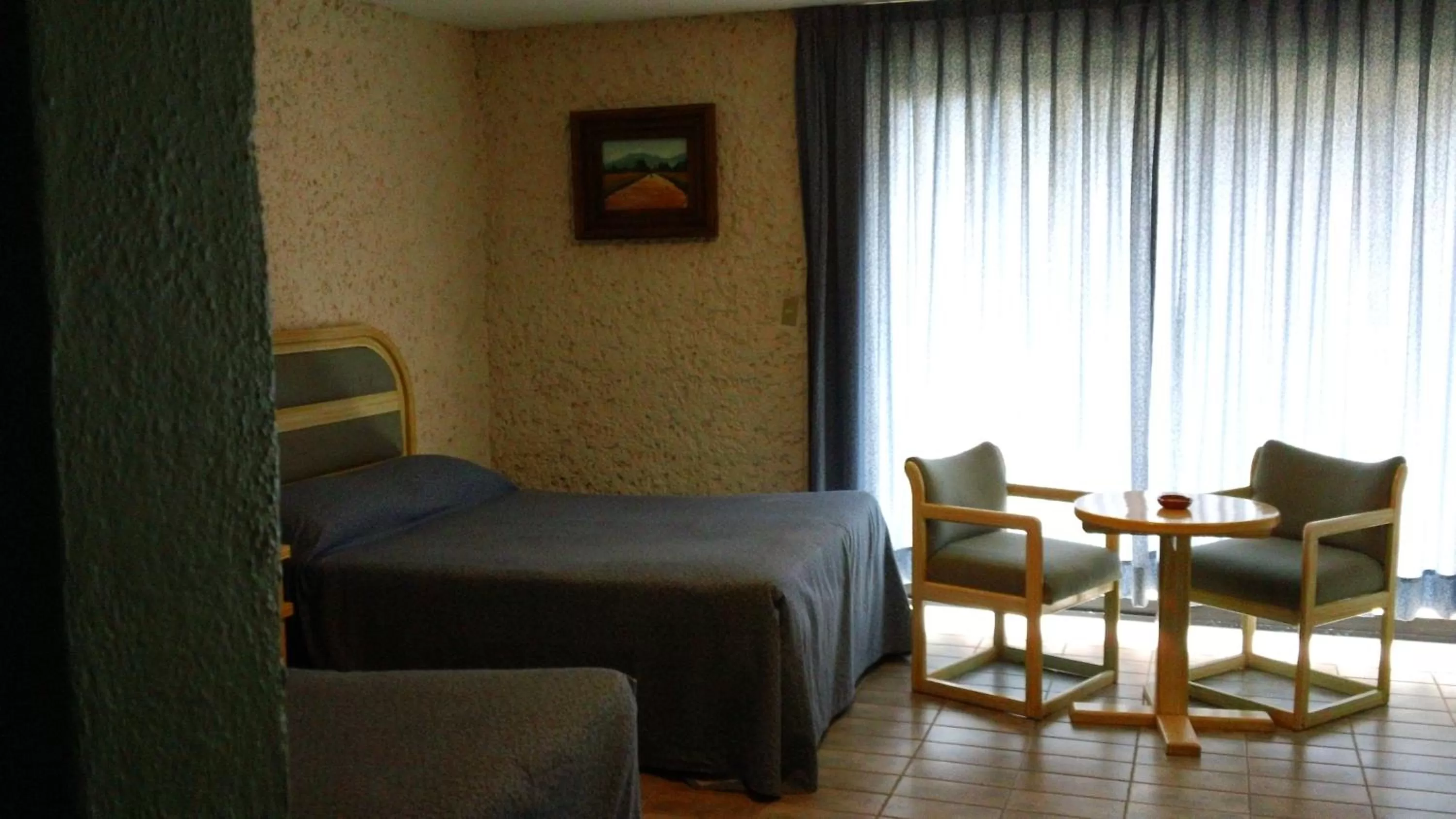 Bedroom in Hotel Villa Monarca Inn