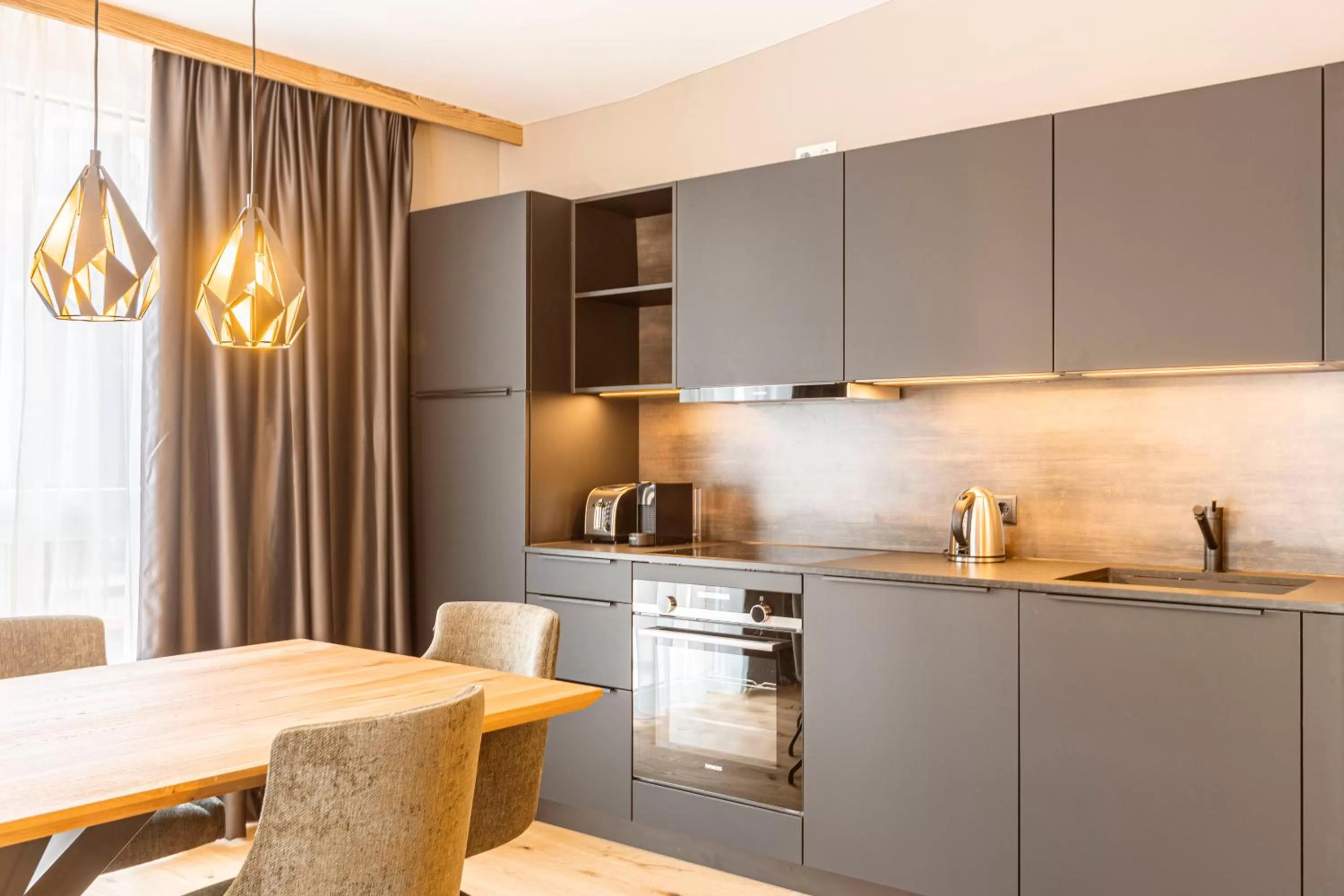 Kitchen or kitchenette in Zillertal Suites Fügen by ALPS RESORTS