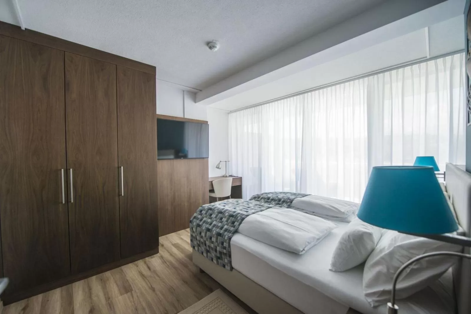 Photo of the whole room, Bed in Boutiquehotel Wörthersee - Serviced Apartments