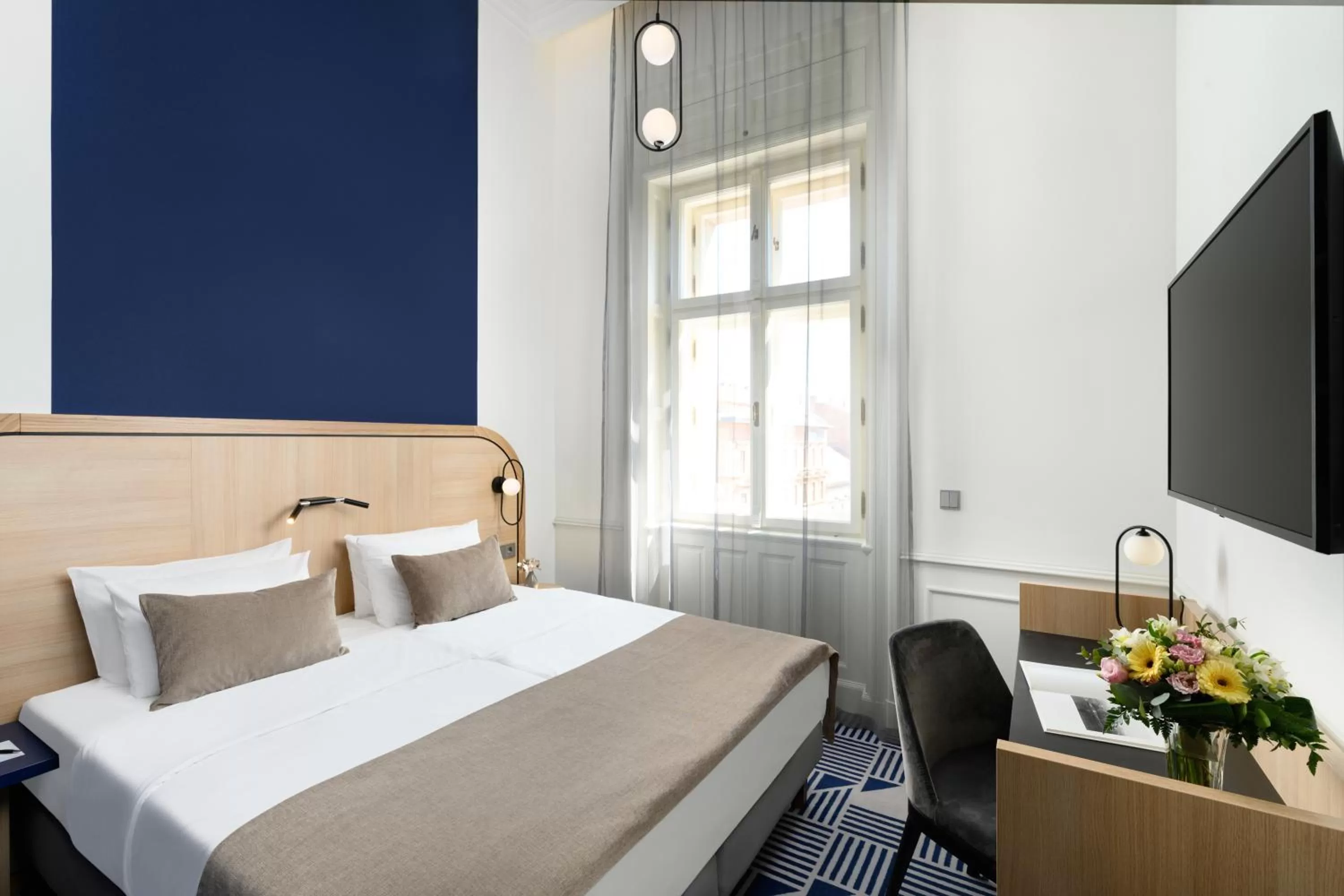 Photo of the whole room, Bed in Hotel Oktogon Haggenmacher by Continental Group