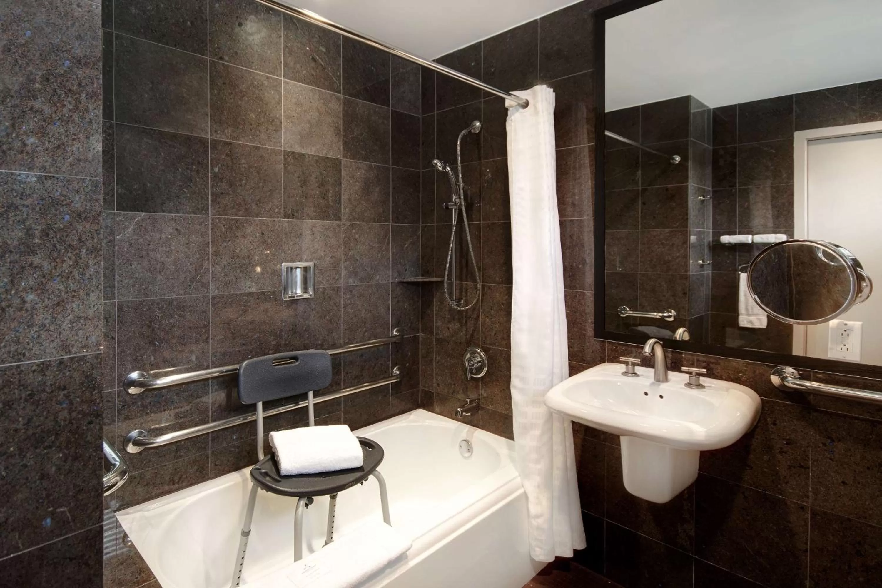 Shower in The Sam Houston Hotel, Curio Collection by Hilton