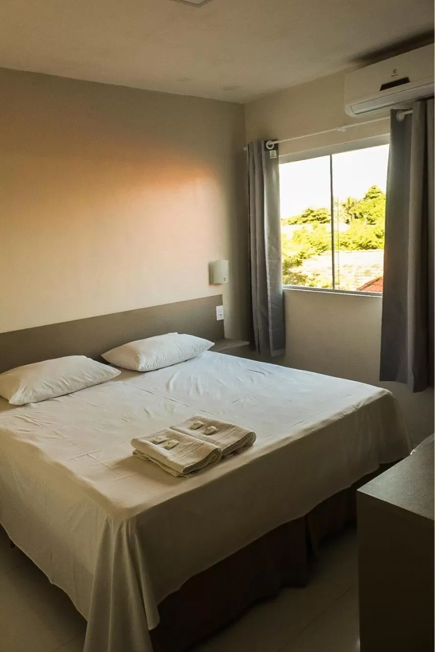 Bed in Pousada Vila do Carmo