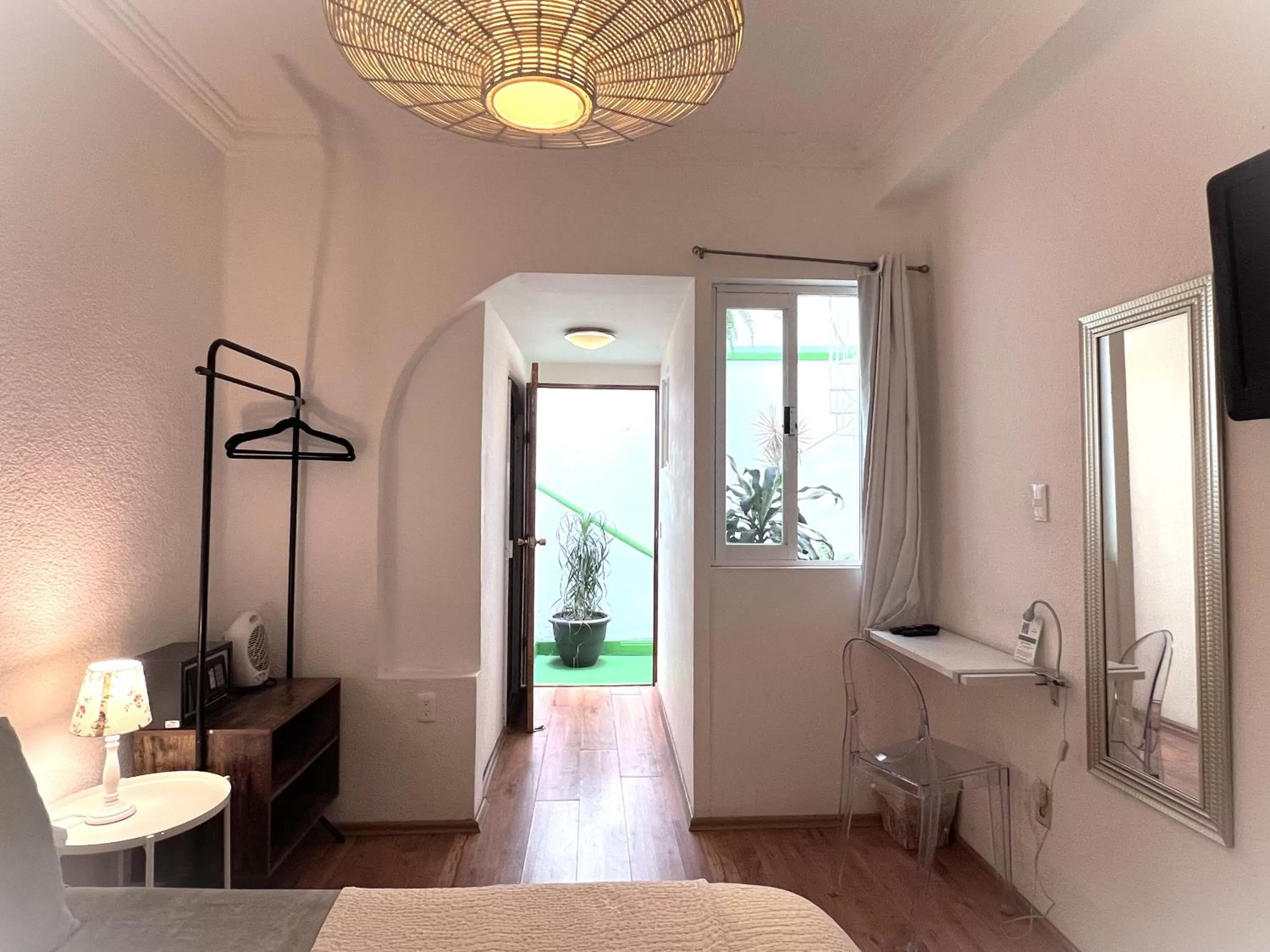 Photo of the whole room in Distrito Condesa Rooms and Studios