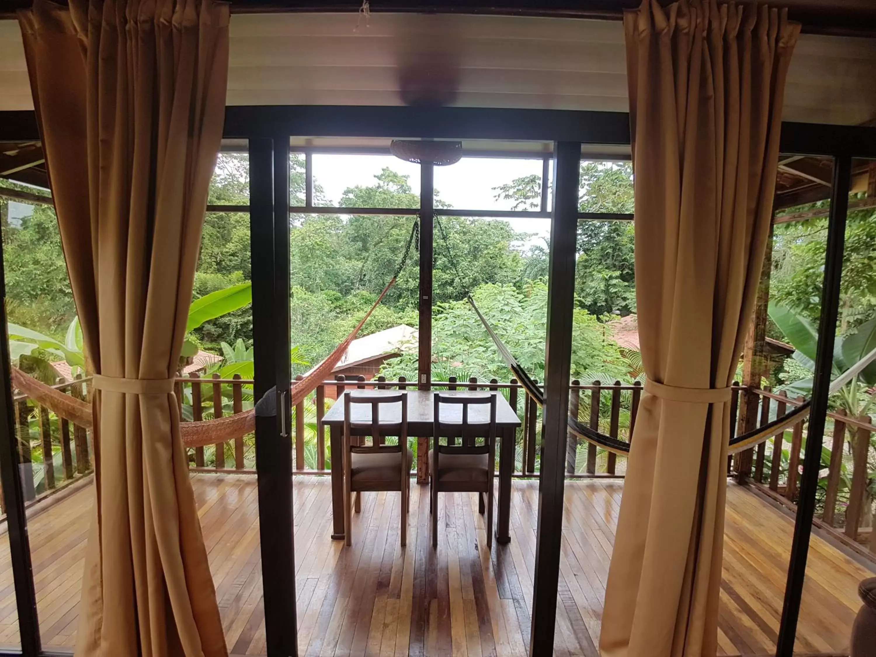 Glass Bungalow with Balcony | 1 Queen Bed & 1 Twin Bed - single occupancy in Hotel Heliconias Nature Inn & Hot Springs Glass Bungalow with Balcony | 1 Queen Bed & 1 Twin Bed - single occupancy in Hotel Heliconias Nature Inn & Hot Springs