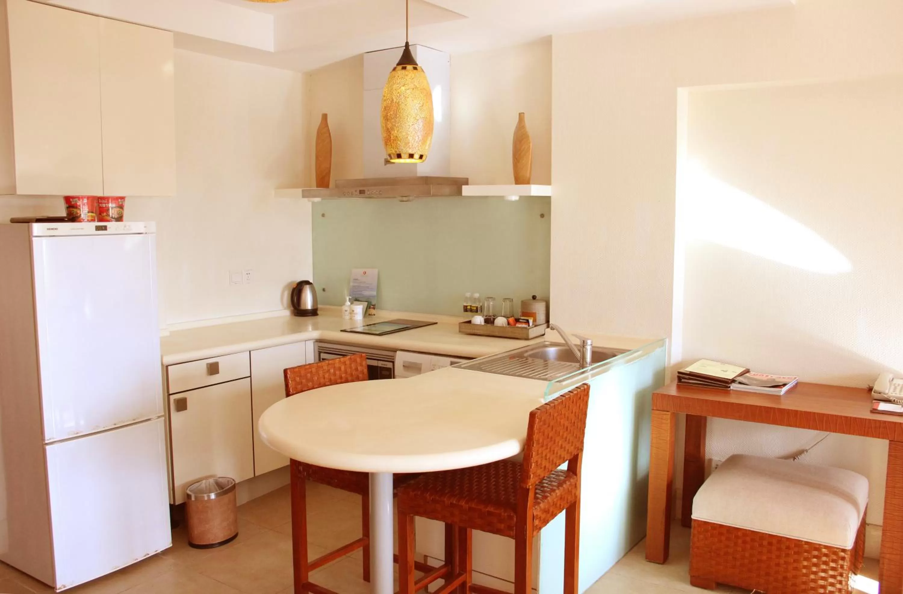 Kitchen or kitchenette in Aegean Suites Sanya Yalong Bay Resort