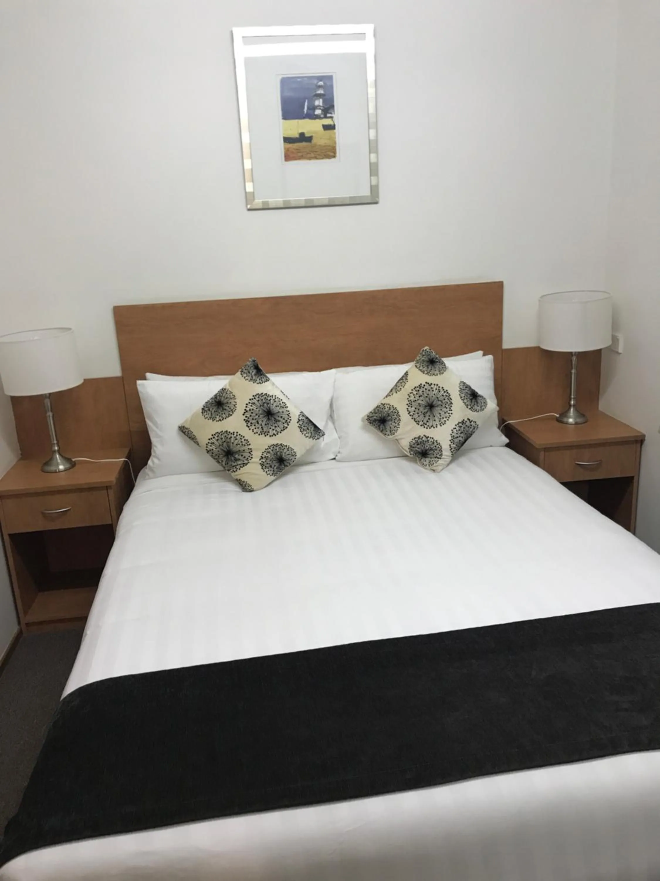 Bed in Bridge View Motel