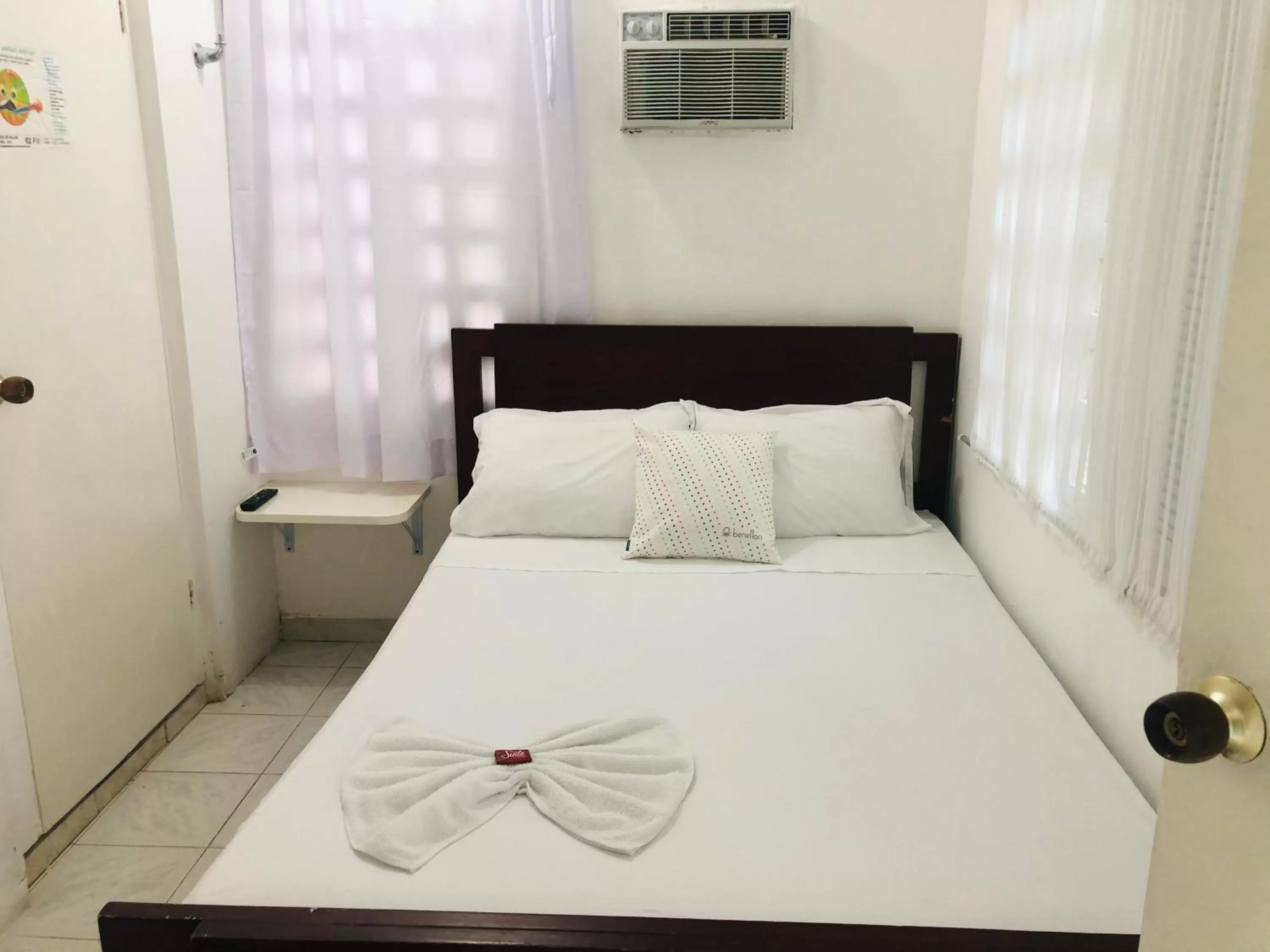 Bed in Tita’s Airport Hotel