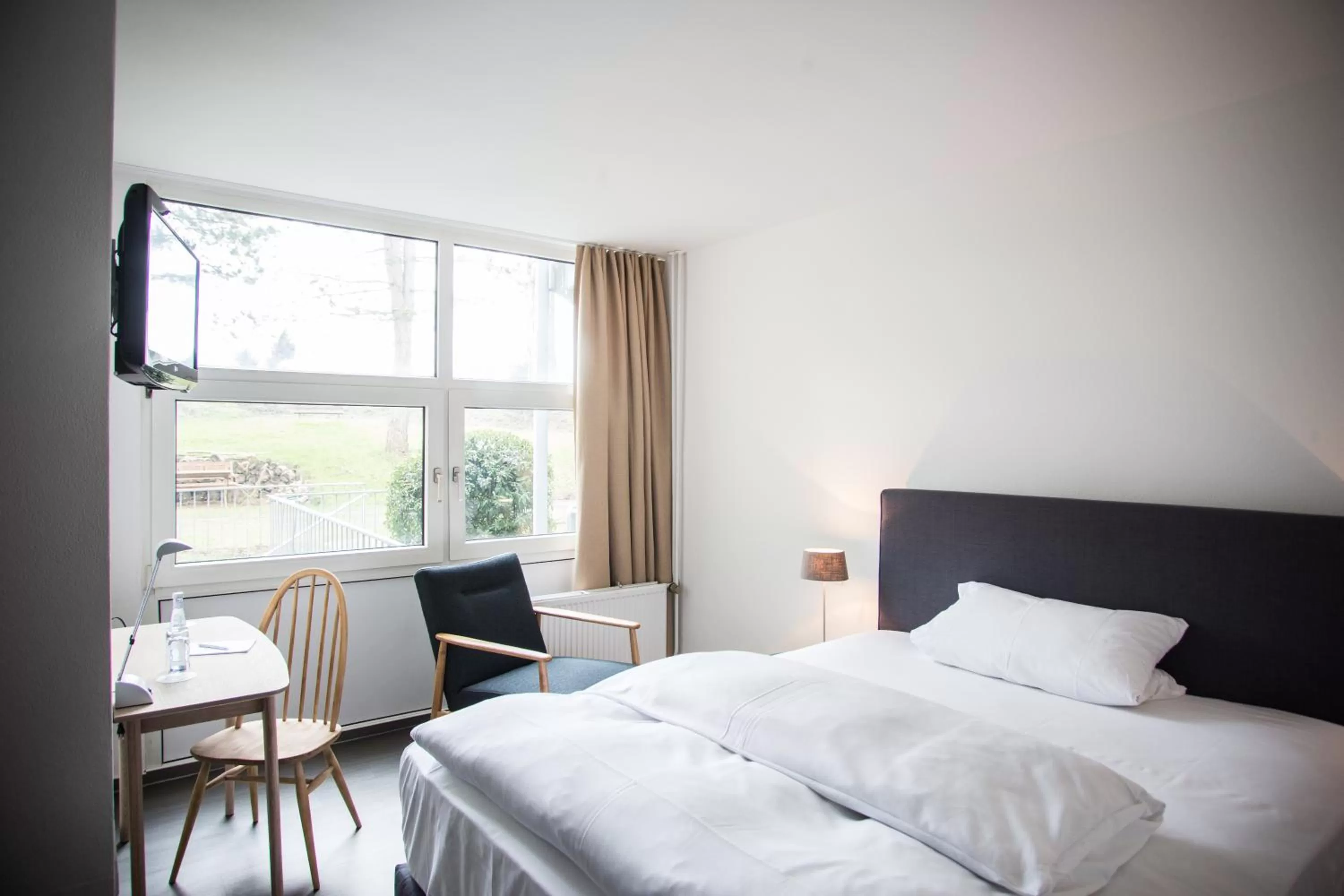 Photo of the whole room, Bed in Wald & Golfhotel Lottental