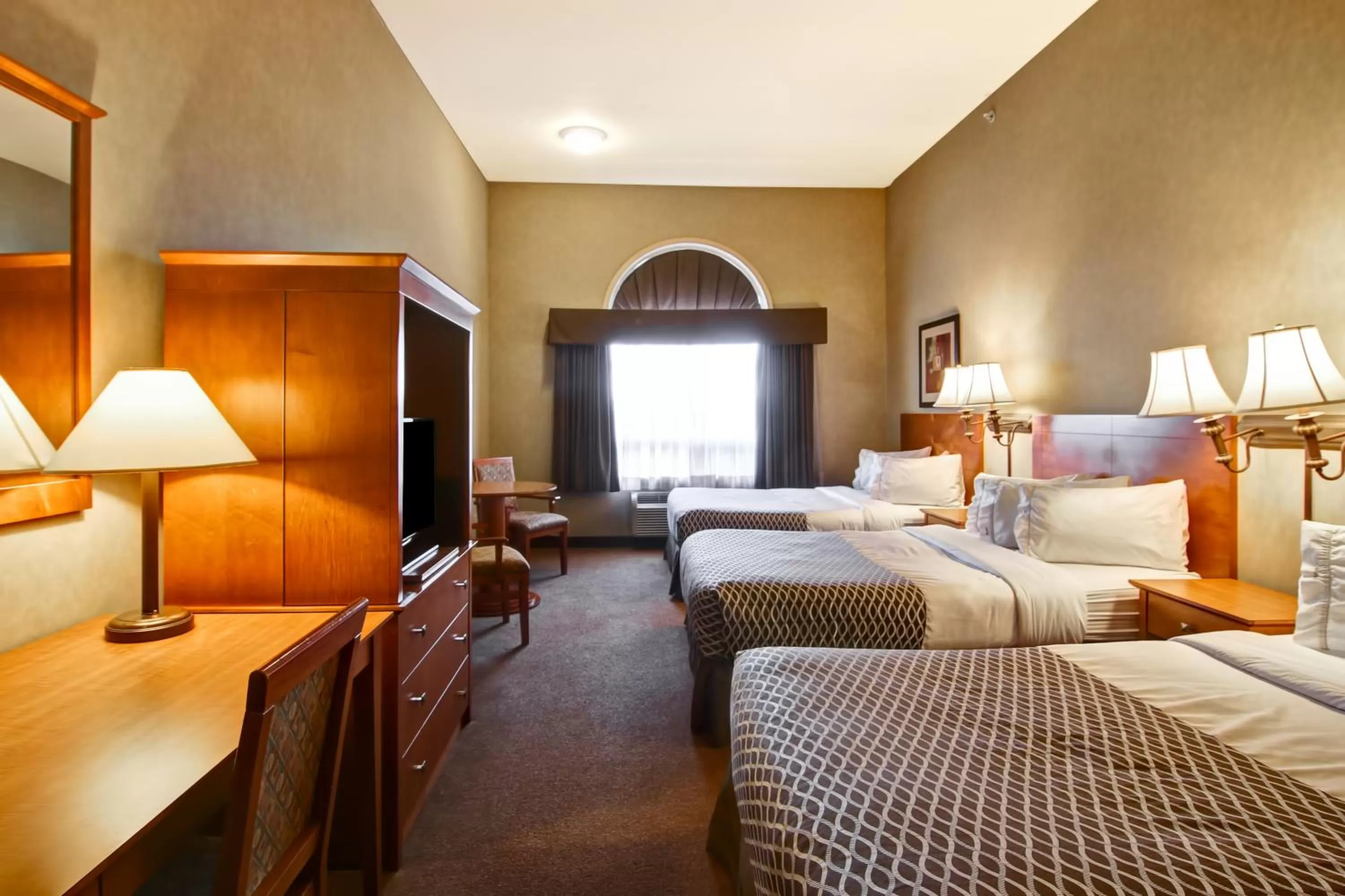 Swimming pool, Bed in Ramada by Wyndham Ponoka