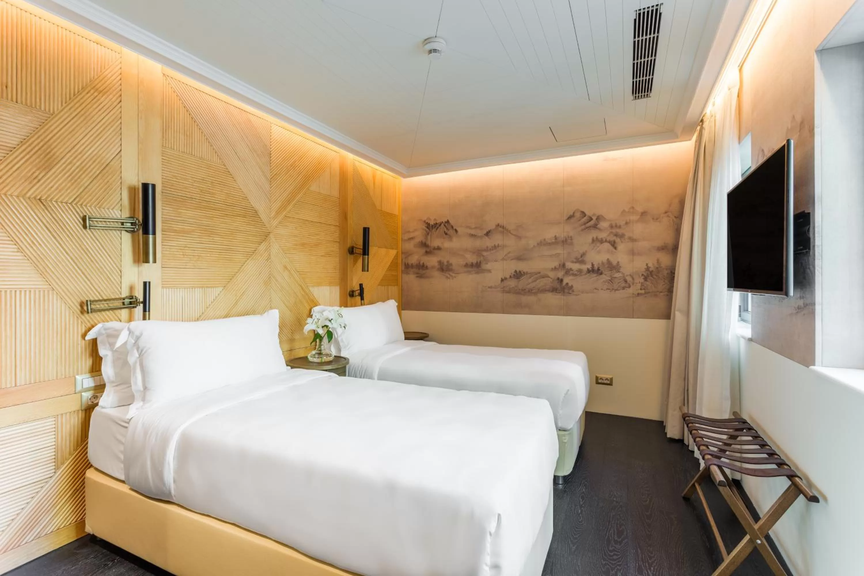 Bed in The Wings Hotels Collection